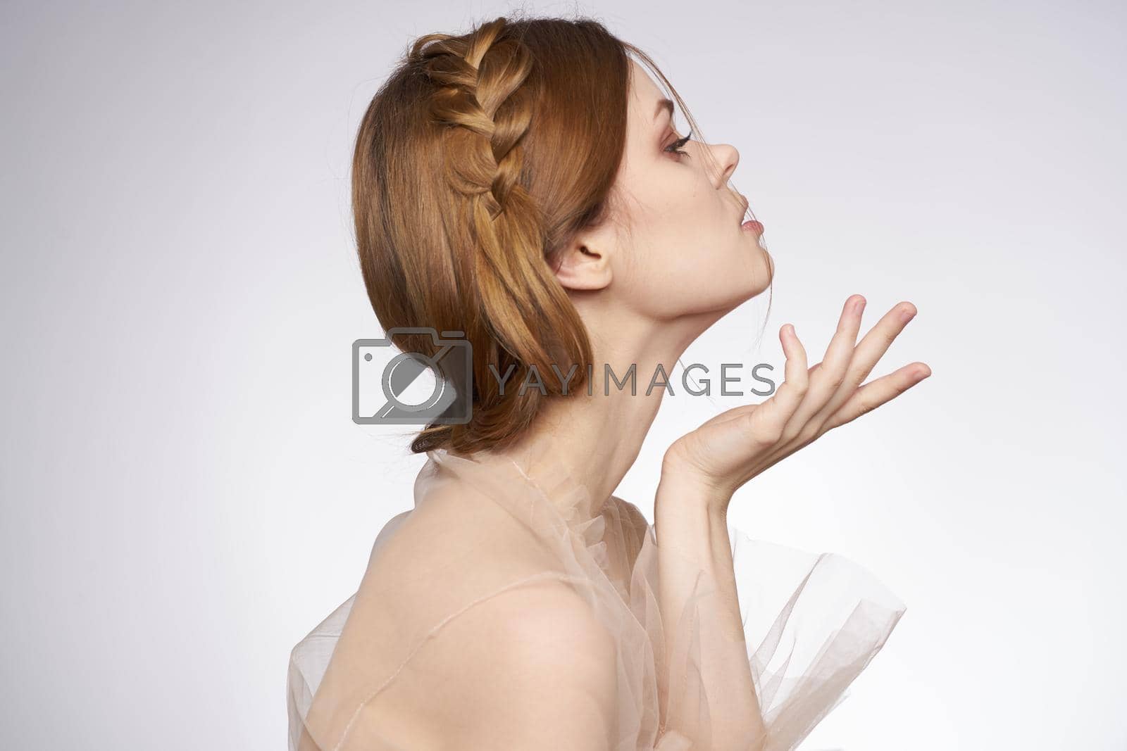 cheerful woman gesture hands cosmetics fashion hairstyle posing model studio. High quality photo