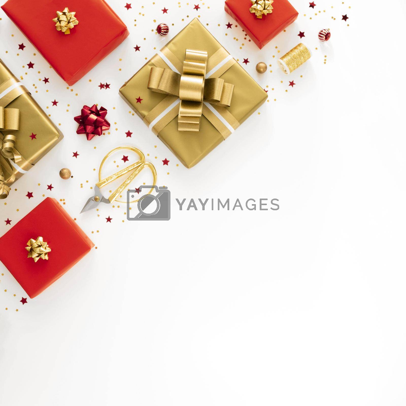 Royalty free image of flat lay arrangement festive wrapped presents with copy space by Zahard