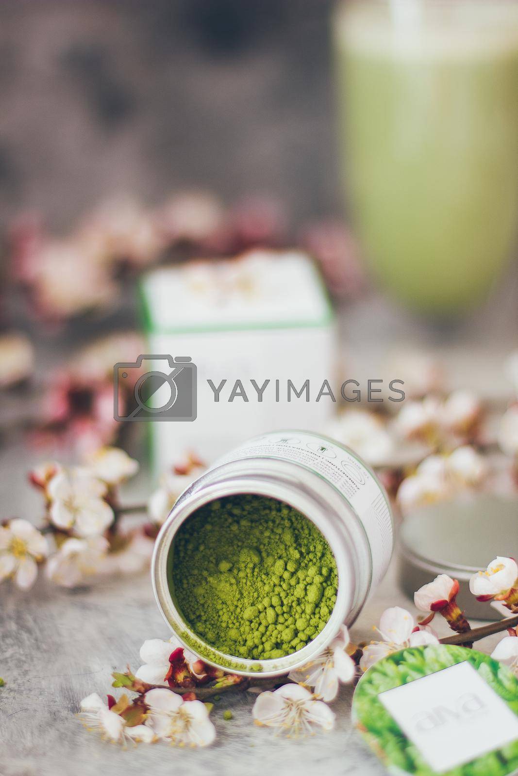 Royalty free image of Matcha tea powder with brunch of cherry blossoms by mmp1206