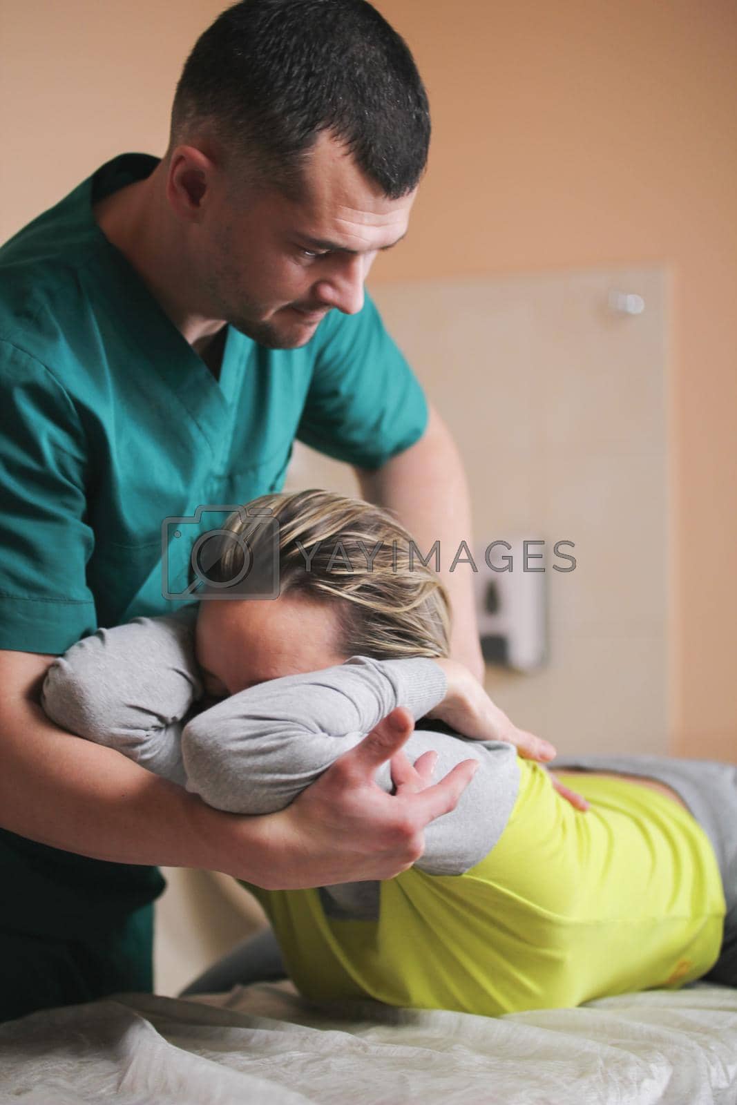 Royalty free image of Doctor osteopath have manual therapy for woman's neck by Studia72