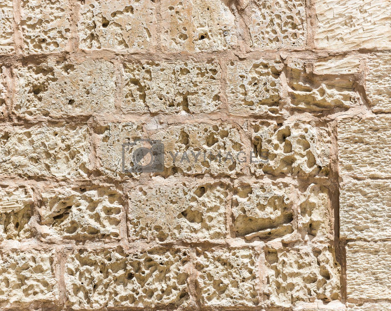 old weathered rough stone wall texture