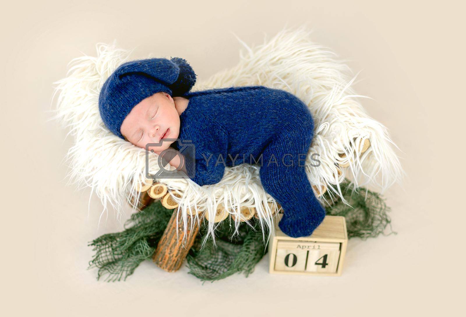 Royalty free image of Newborn sleeping on pedestal by tan4ikk1