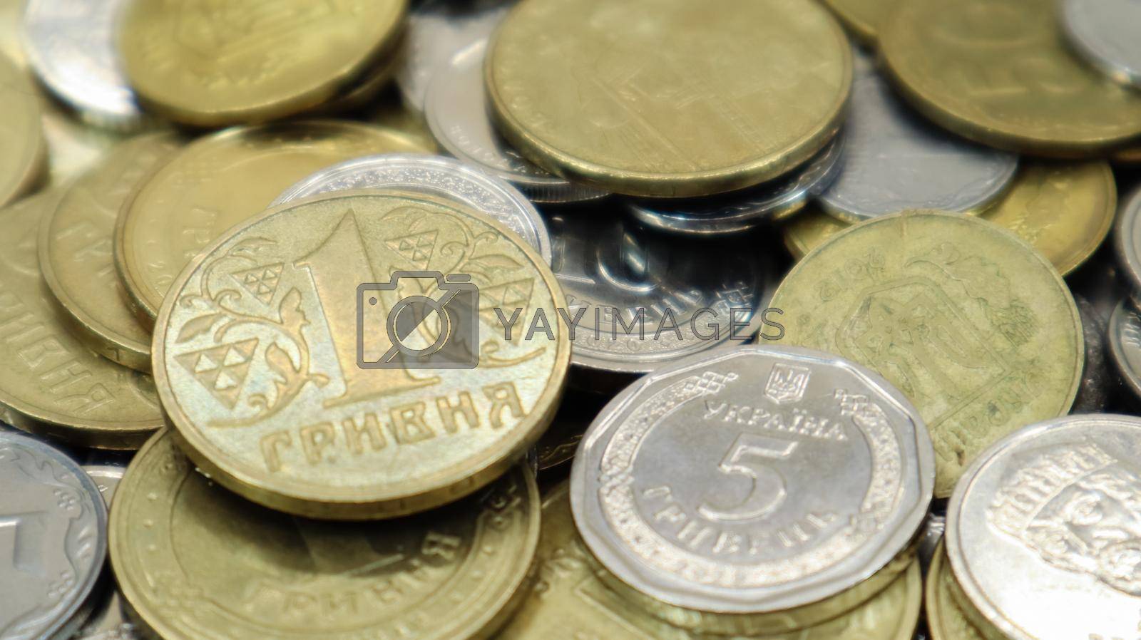 Royalty free image of Many Ukrainian coins. National currency. Business concept. Ukrainian pennies. The concept of denomination of new and withdrawal of old coins. by Roshchyn