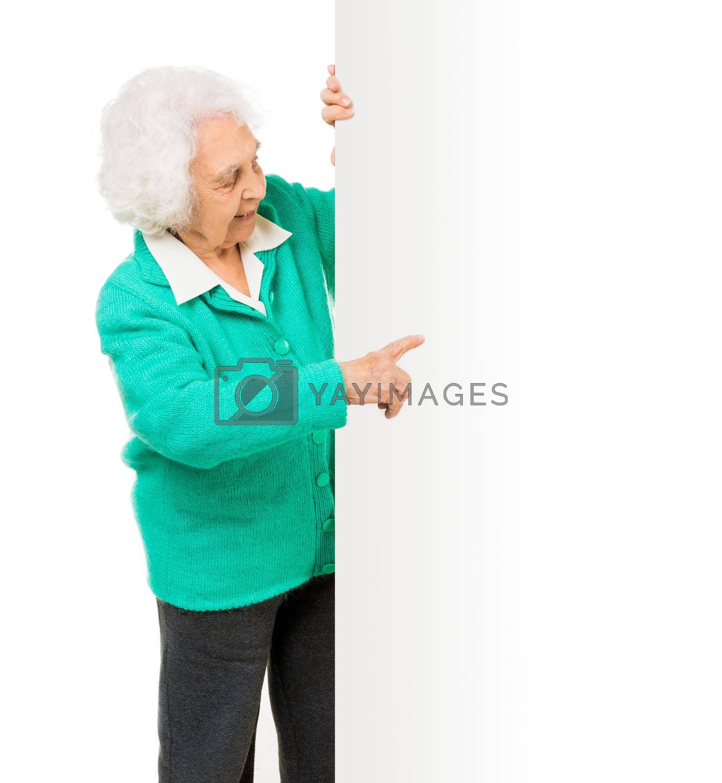 Royalty free image of elderly woman alongside of ad board by tan4ikk1