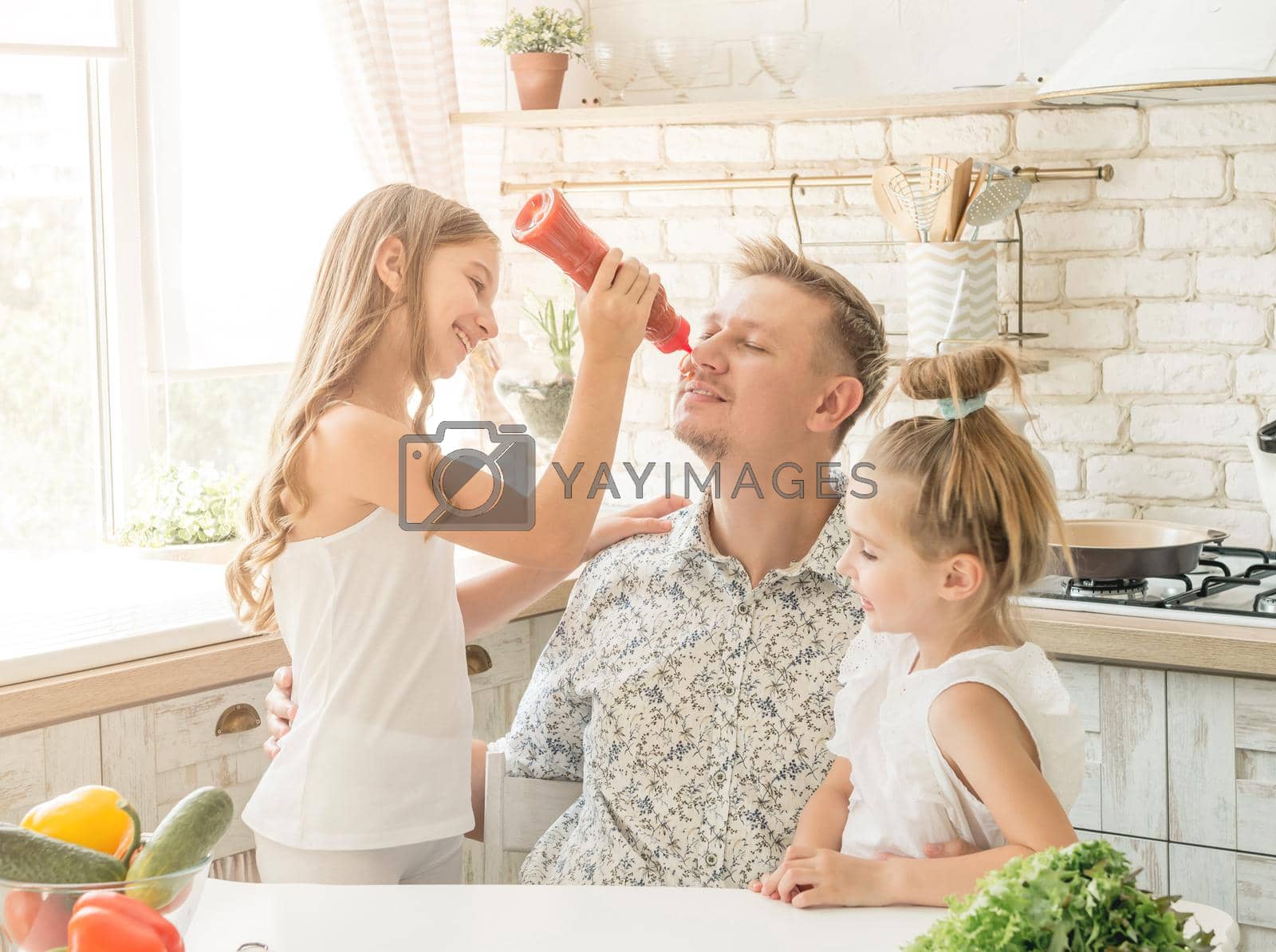 Royalty free image of dad with daughters have a fun by tan4ikk1