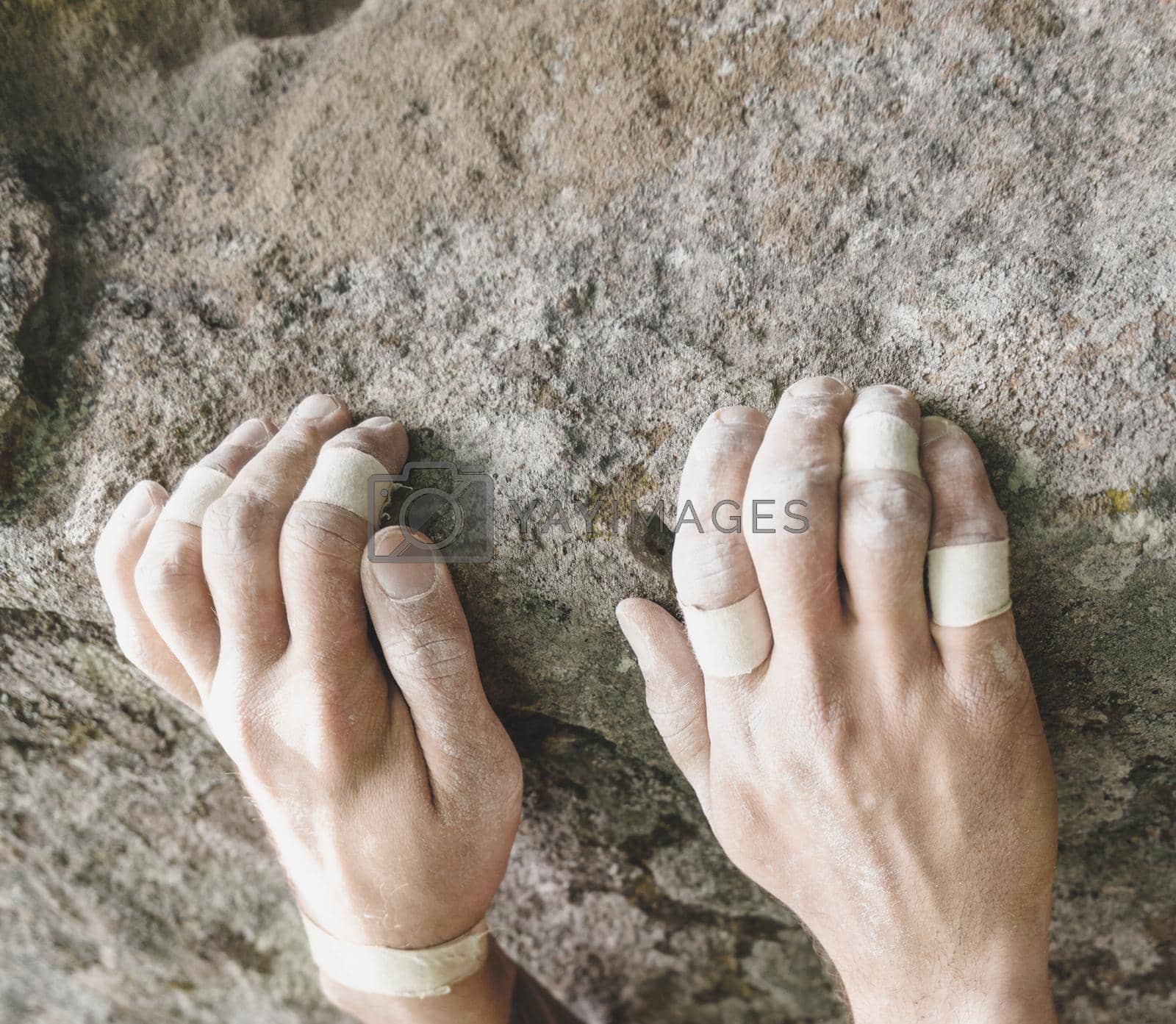 Royalty free image of Climbing on rock, view of hands. by alexAleksei