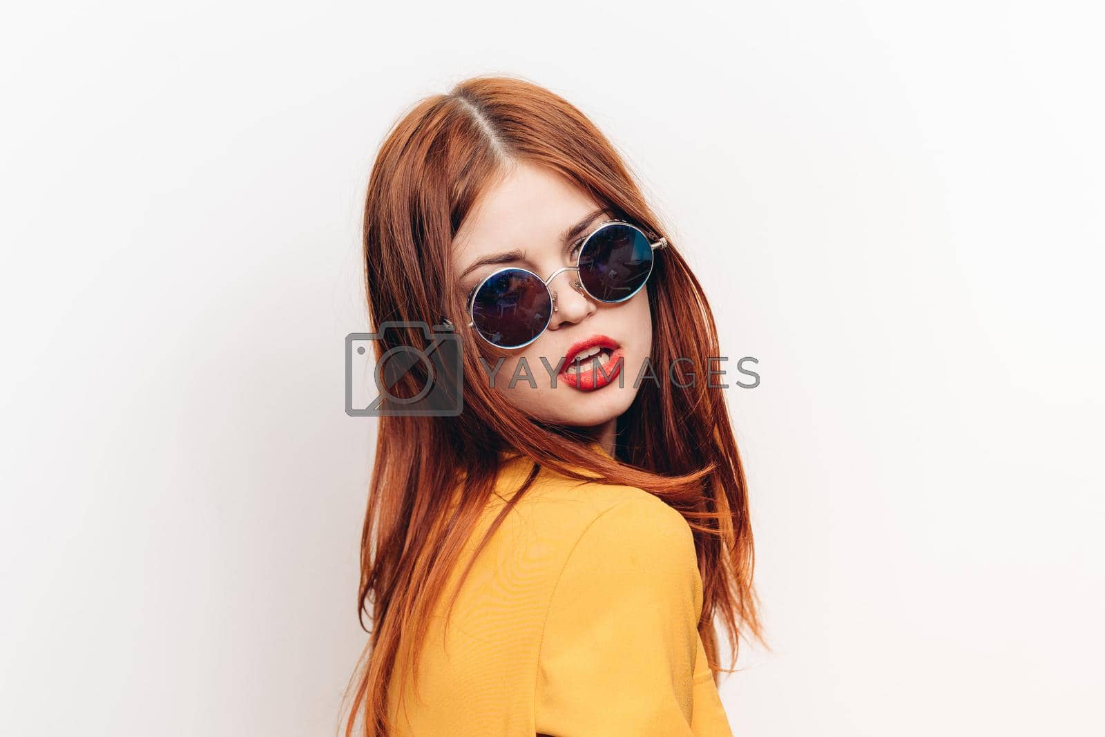 Royalty free image of attractive woman hairstyle glamor sunglasses glamor light background by Vichizh