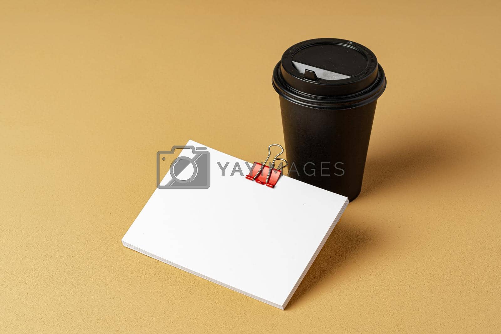 Royalty free image of Blank takeaway coffee cup and white businesscards by Fabrikasimf