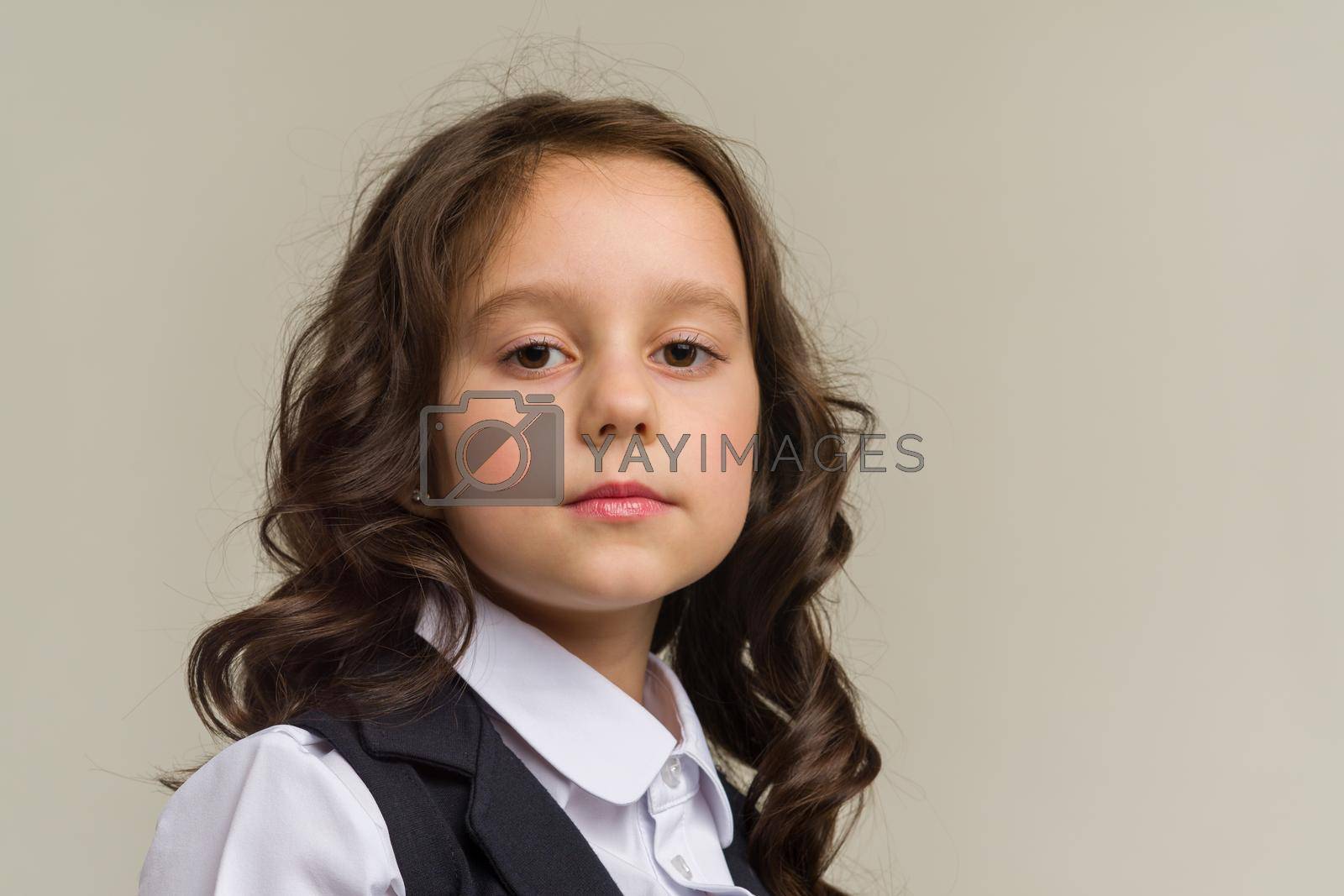Royalty free image of Photo of smiling little girl child isolated over grey background. by zartarn