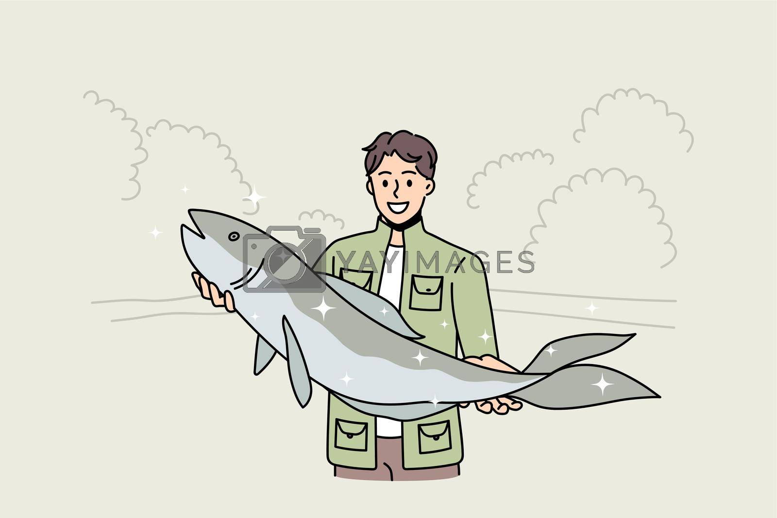 Royalty free image of Smiling fisherman hold big fish haul by VECTORIUM