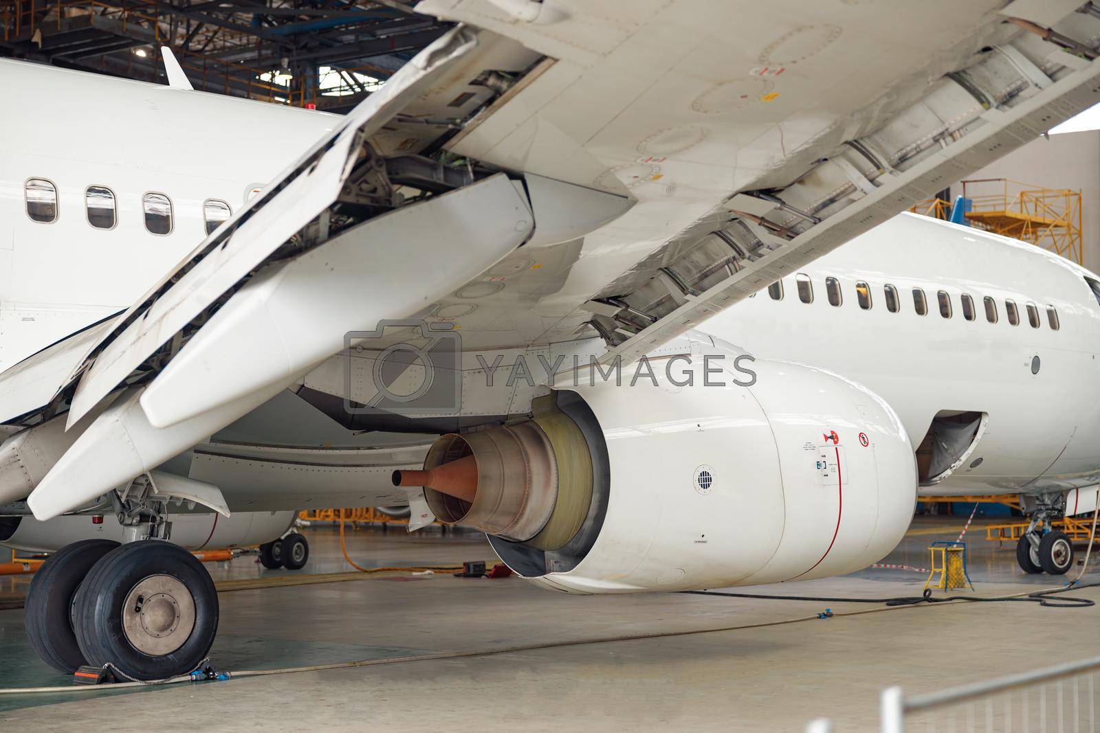 Royalty free image of Close up shot of aircraft engine jet under maintenance in the hangar indoors by Yaroslav_astakhov