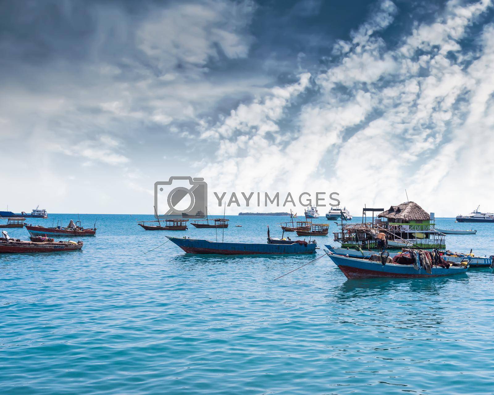 Royalty free image of seascape with many anchored fishing boats by GekaSkr
