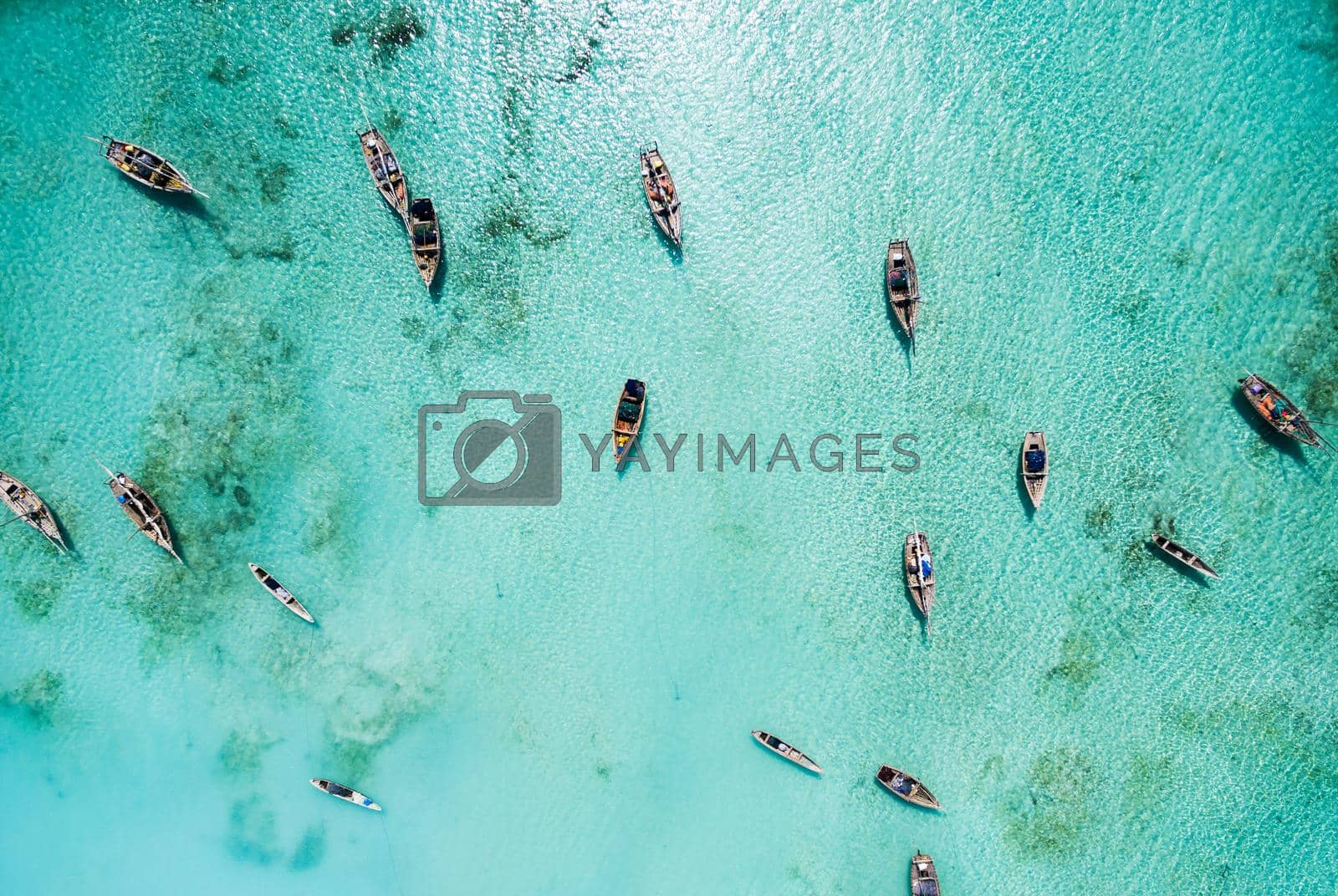 Royalty free image of lots of fishing boats in clear ocean near Africa by GekaSkr