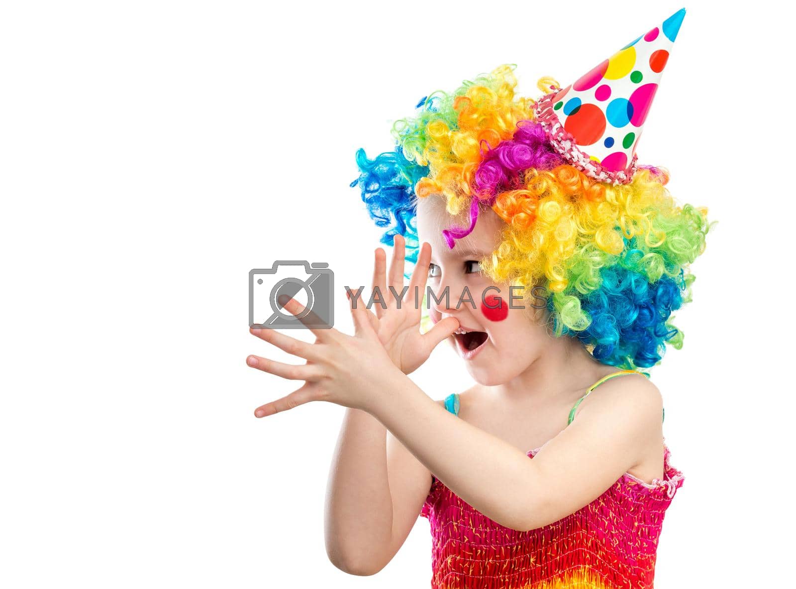 Royalty free image of Little kid clown shows something funny by tan4ikk1