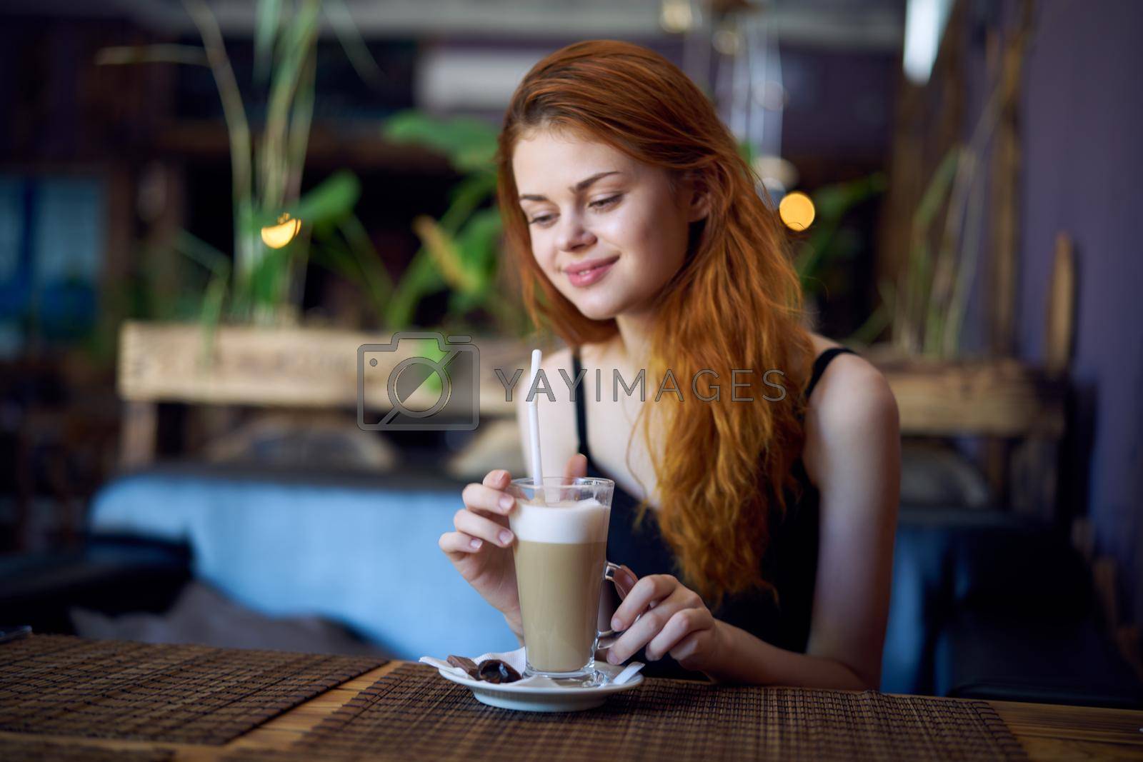 Royalty free image of pretty woman in cafe drink communication relaxation by Vichizh