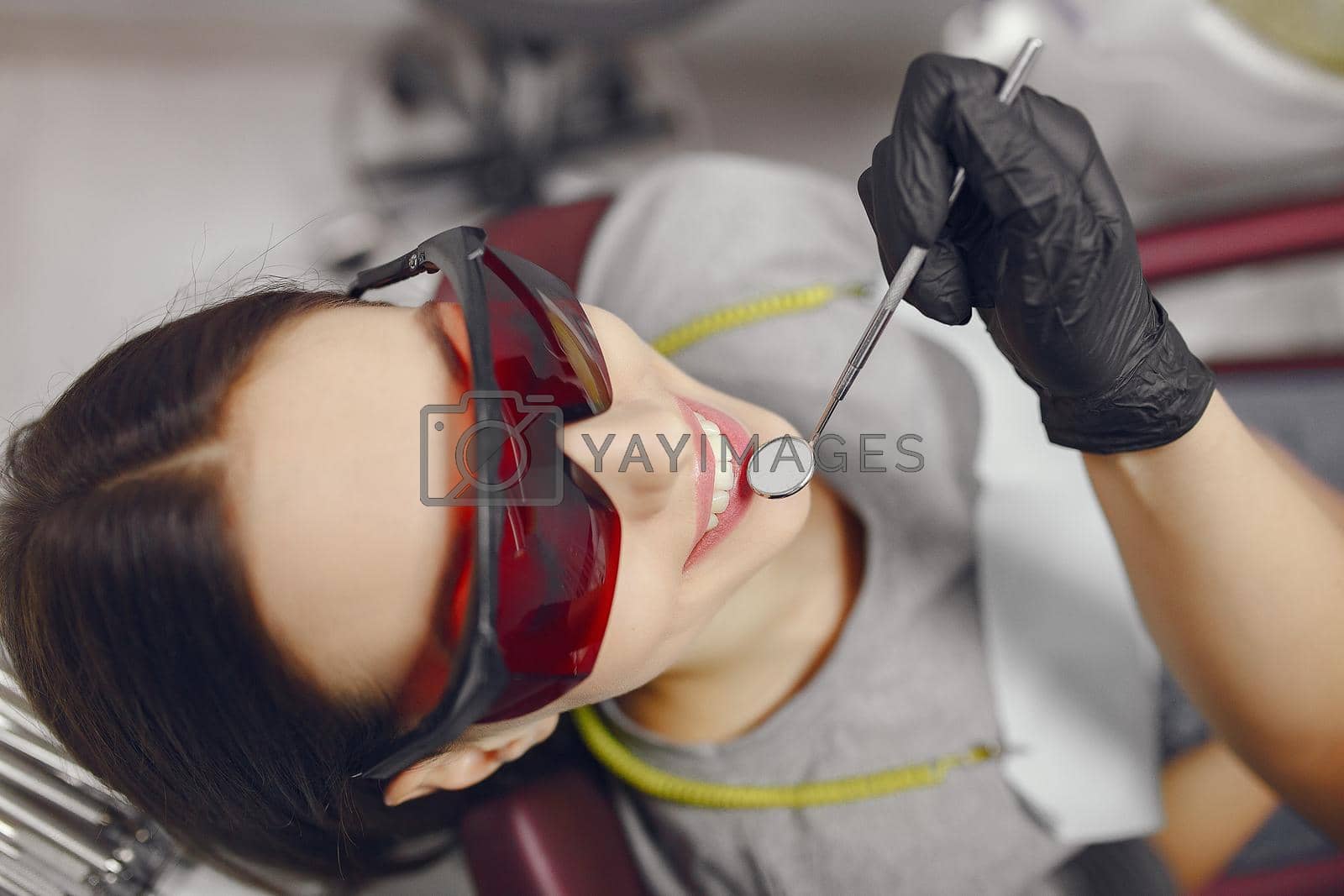 Royalty free image of Beautiful girl sitting in the dentist's office by prostooleh
