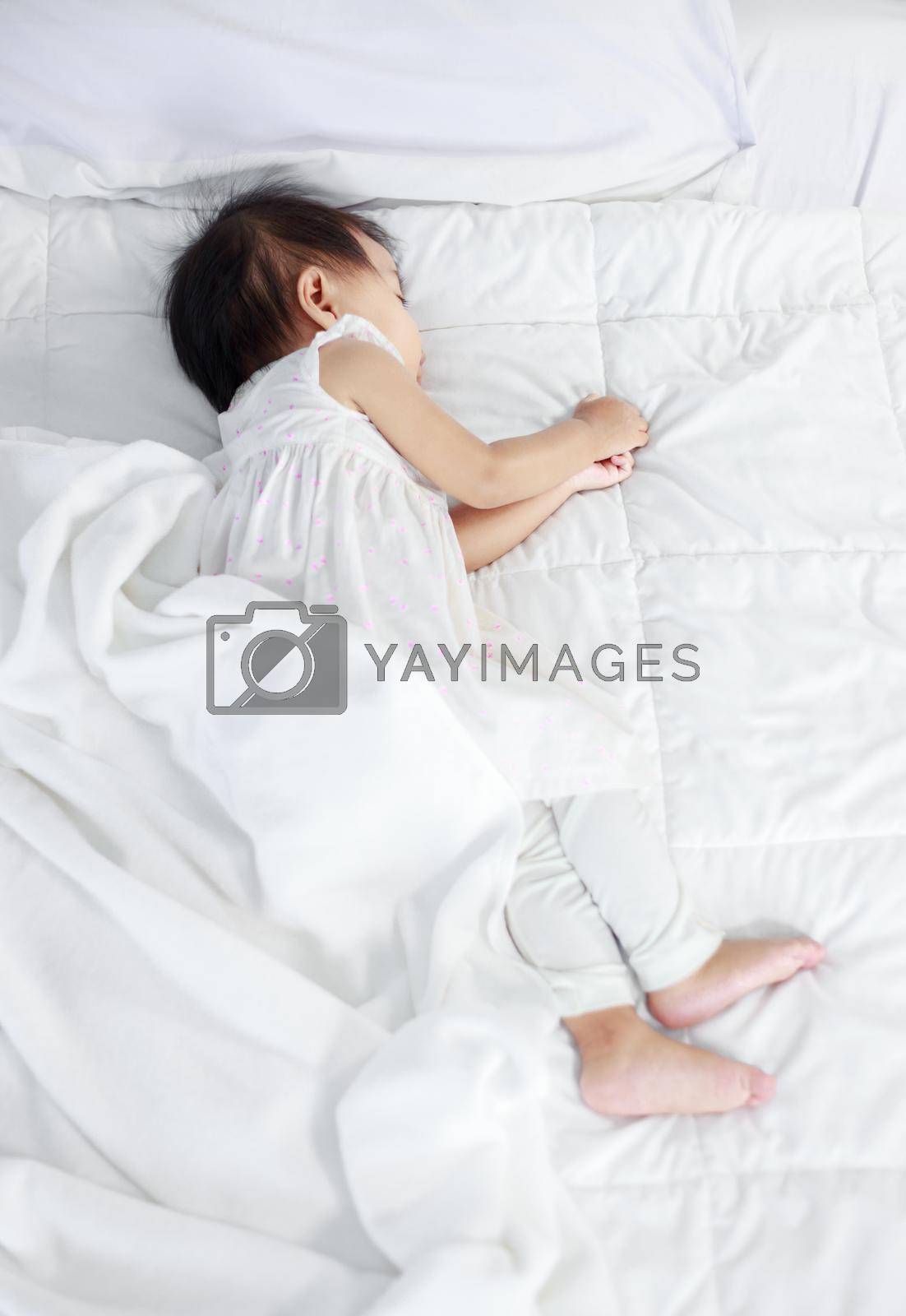 Royalty free image of baby sleeping on bed at home by geargodz