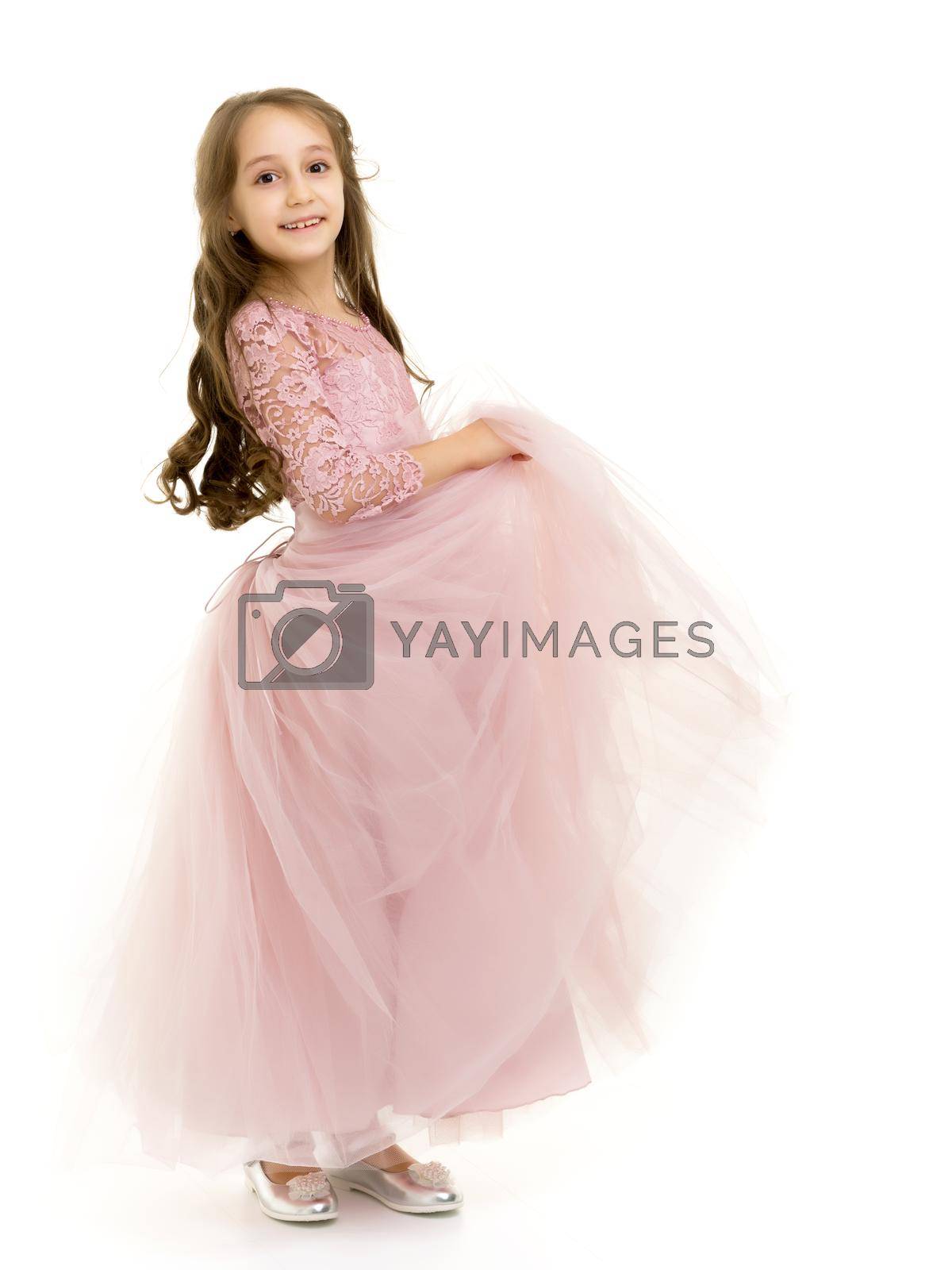 Royalty free image of Portrait of Teen Girl in Dress Standing Half Turn. by kolesnikov_studio