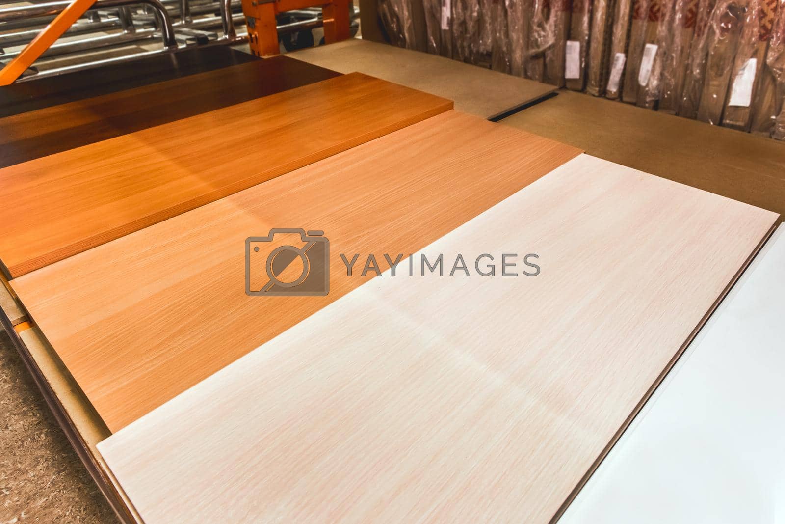 Royalty free image of Particleboard, pressed wood boards, building materials in a hardware store by AYDO8