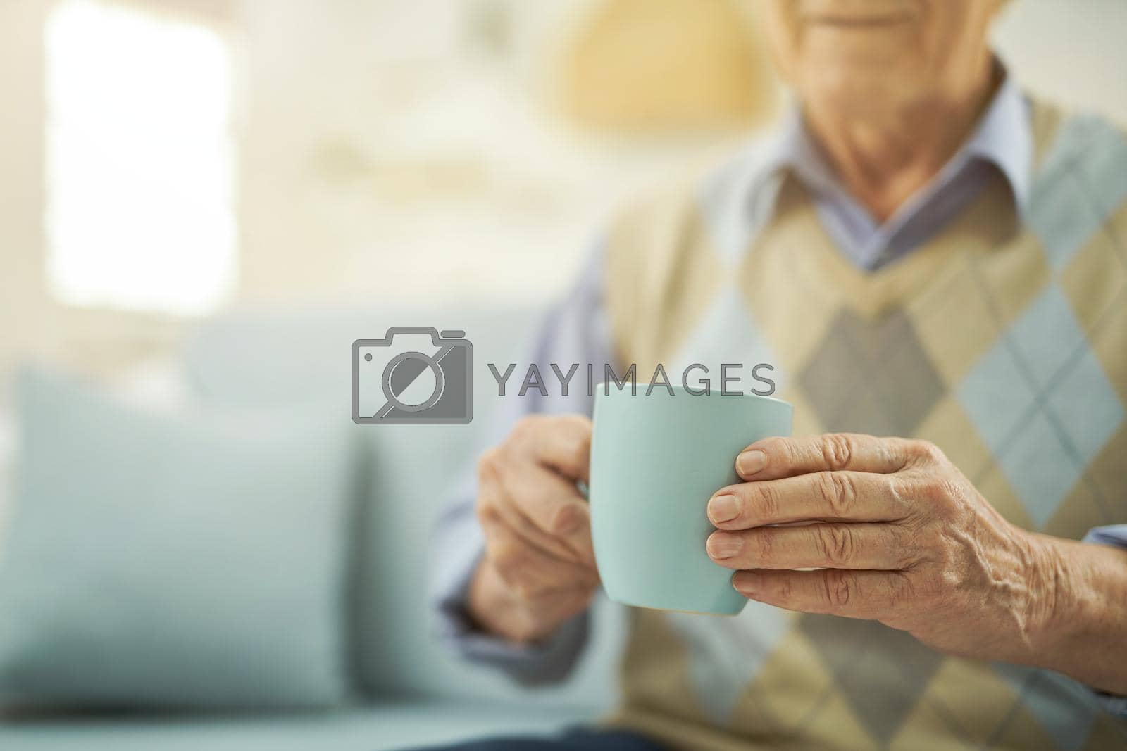 Royalty free image of Pensioner resting at home with a cup of hot tea by friendsstock