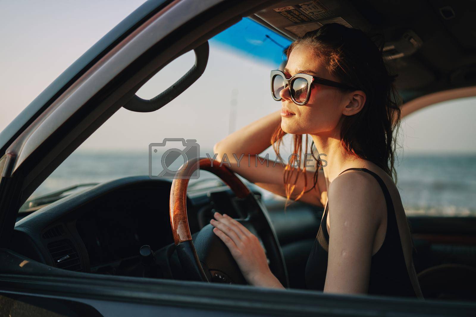 woman driving in car trip posing fashion travel. High quality photo
