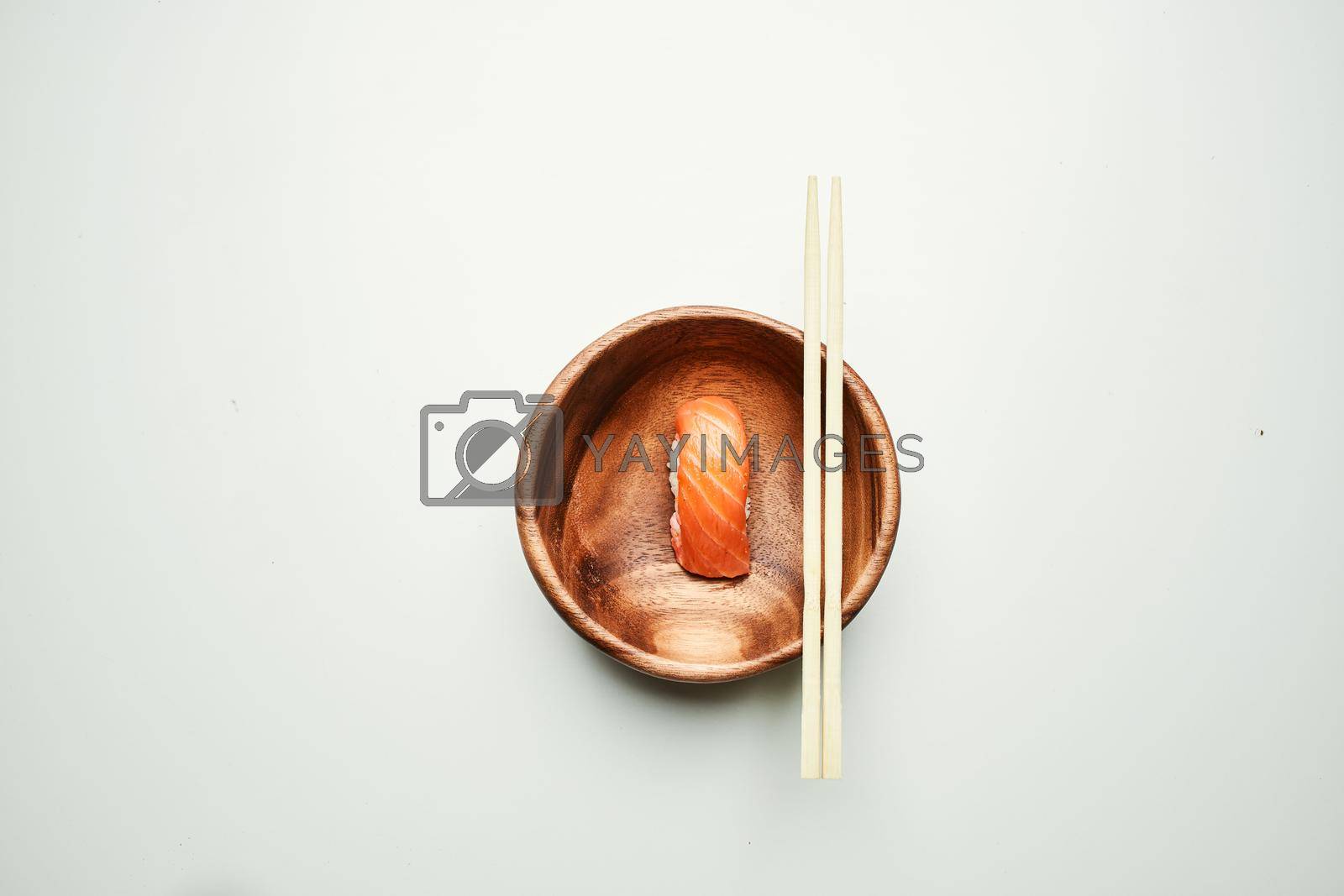 wooden plate sushi chopsticks japanese cuisine sea food. High quality photo