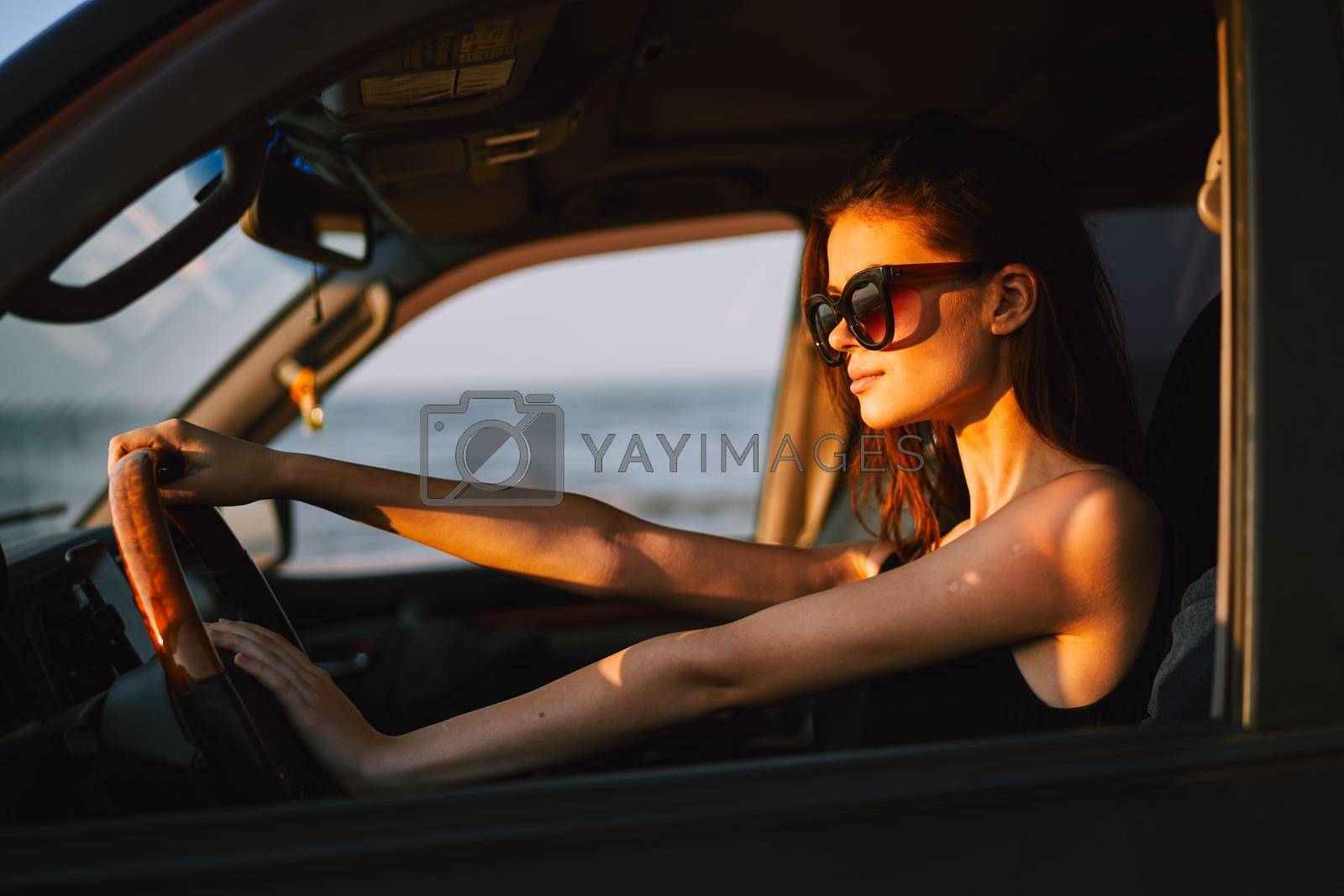 woman driving in car trip posing fashion travel. High quality photo