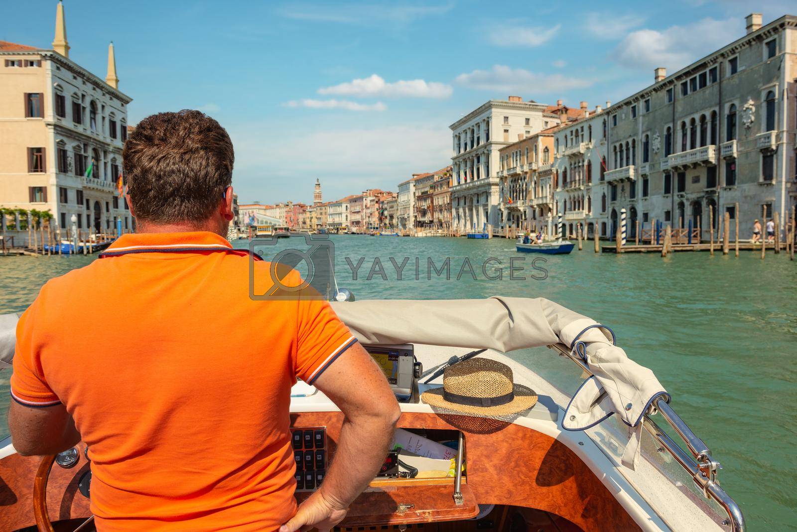 Royalty free image of Boats in venetian canal by Givaga