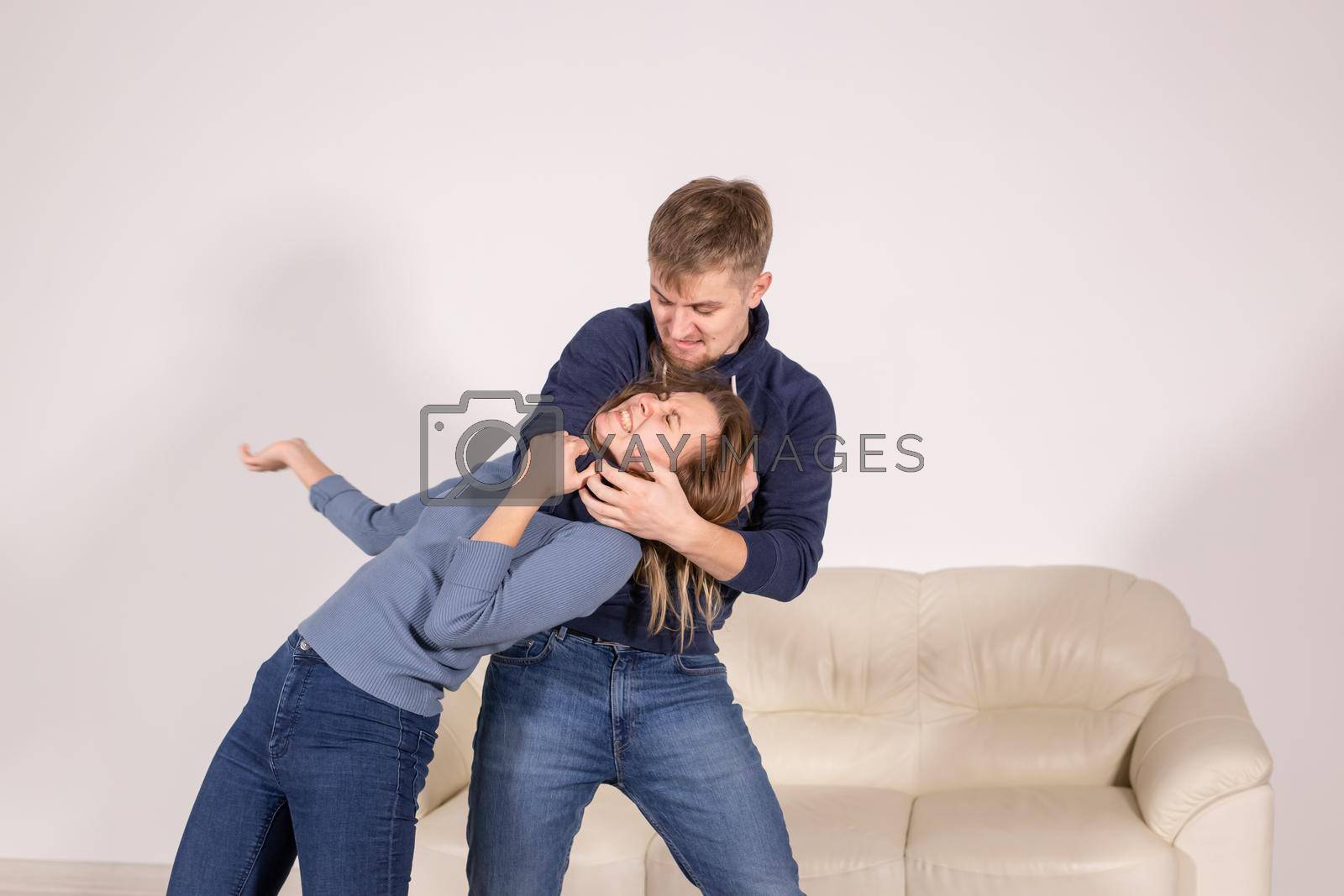Royalty free image of people, abuse and violence concept - agressive man strangling his wife by Satura86