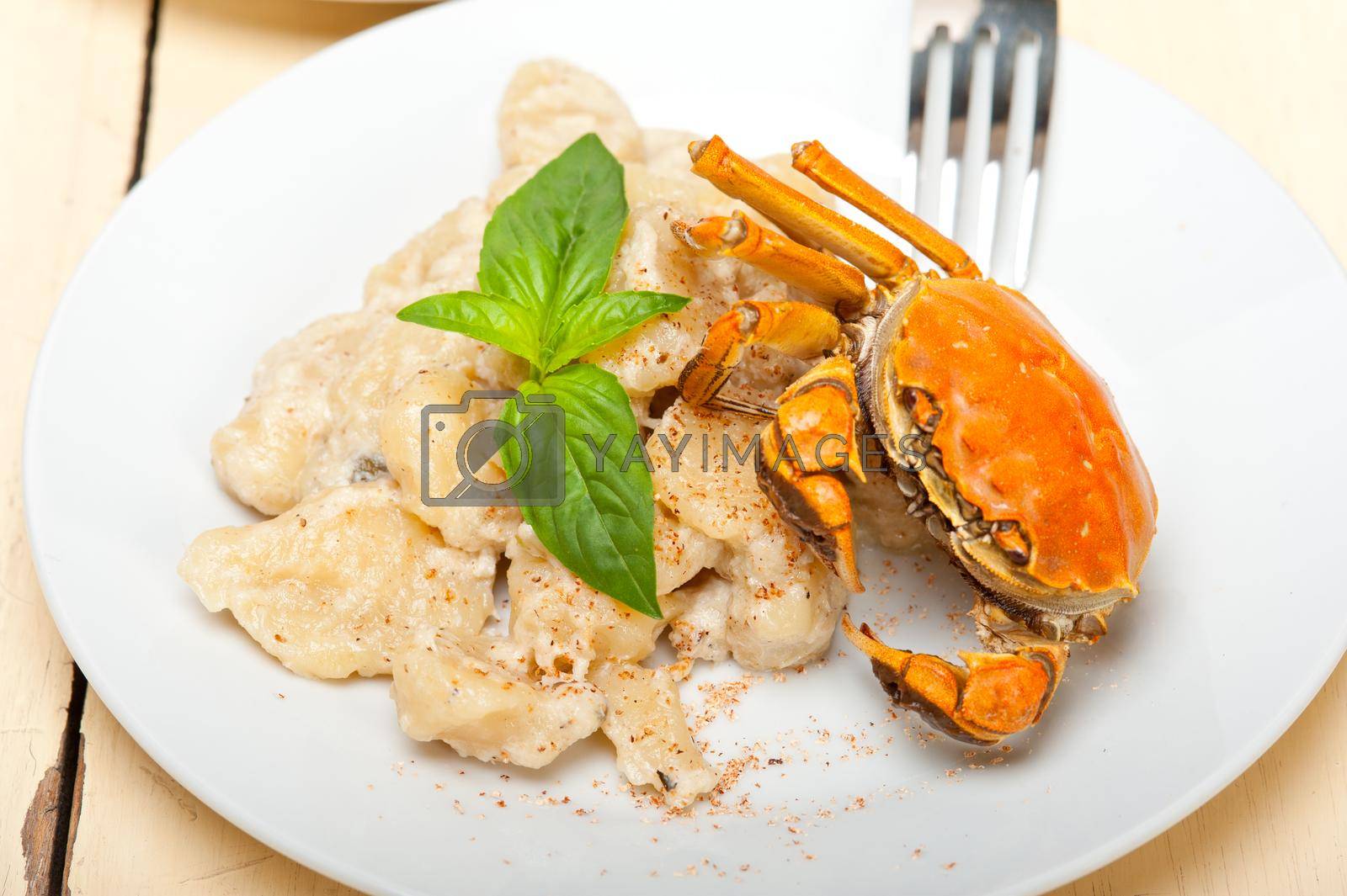 Royalty free image of Italian gnocchi with seafood sauce with crab and basil by keko64