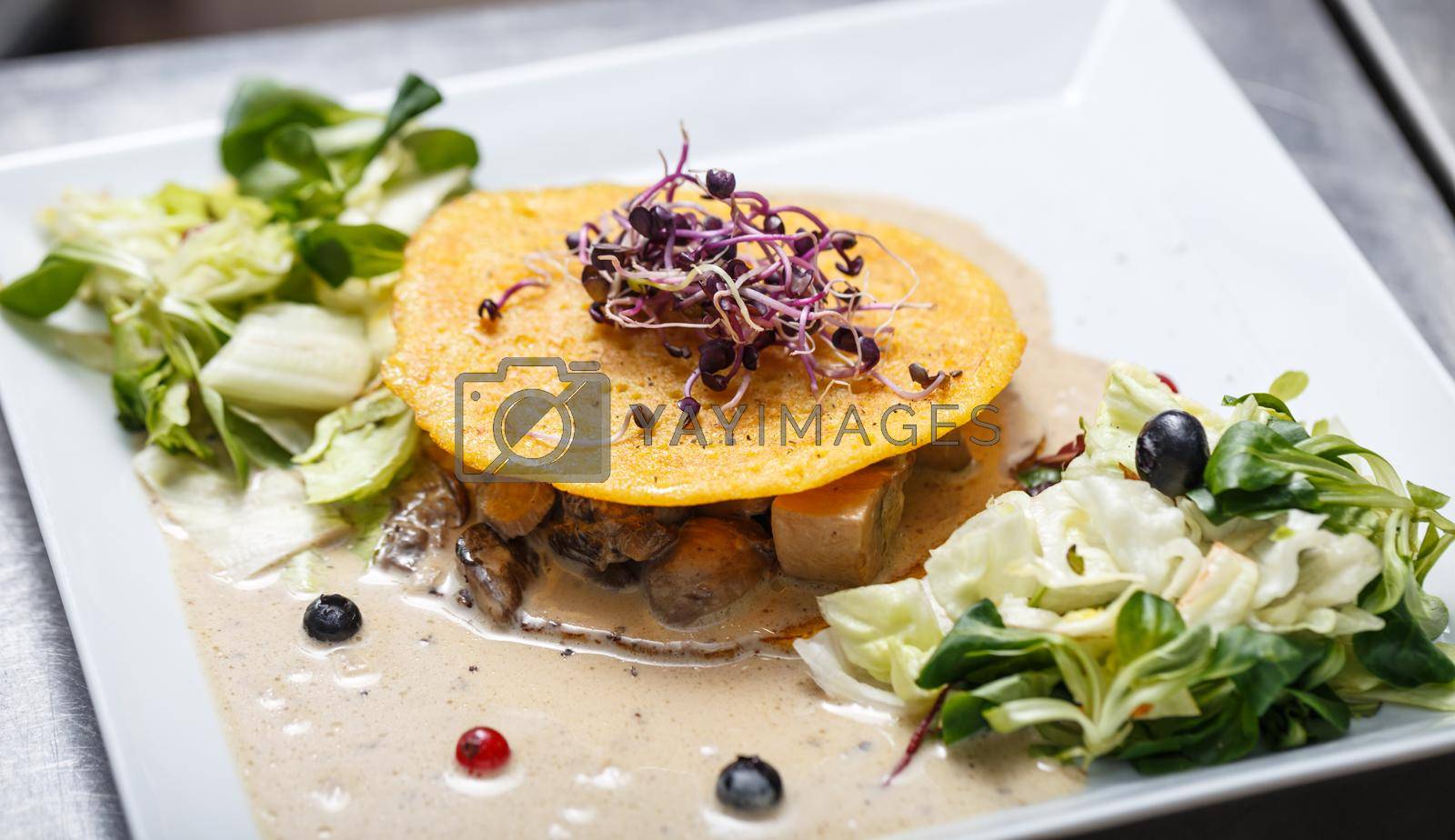 Delicious vegetarian food with mushrooms sauce, lettuce and egg pancake