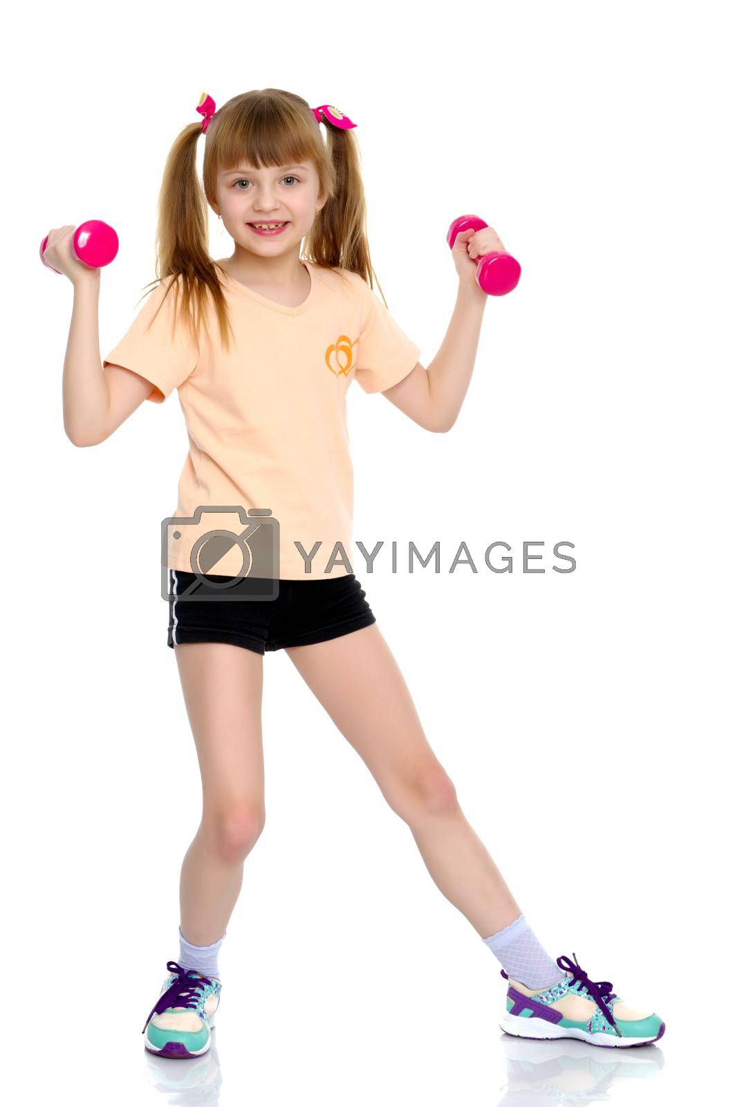 Royalty free image of A little girl does gymnastic exercises. by kolesnikov_studio