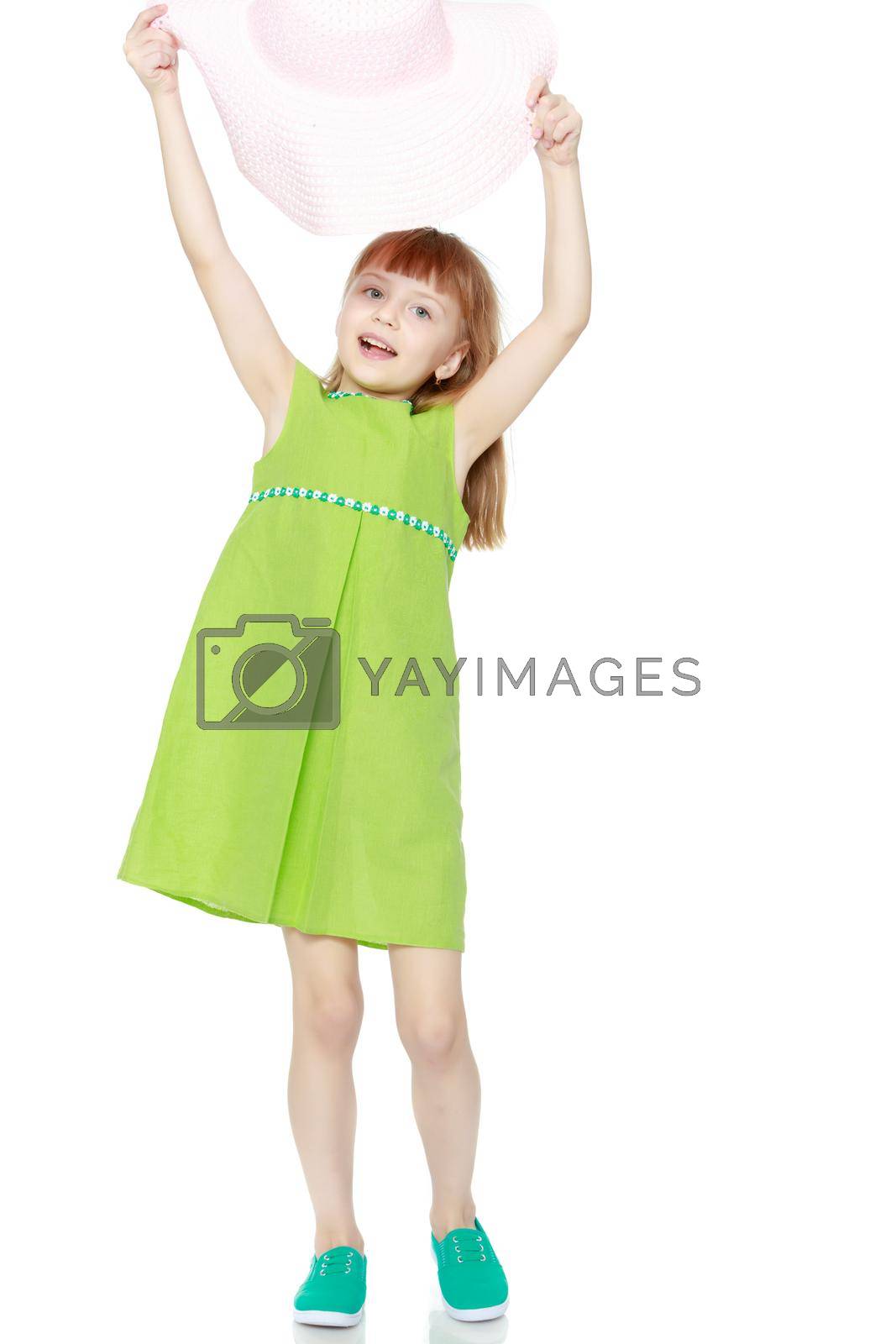 Royalty free image of A little girl in a summer green dress. by kolesnikov_studio