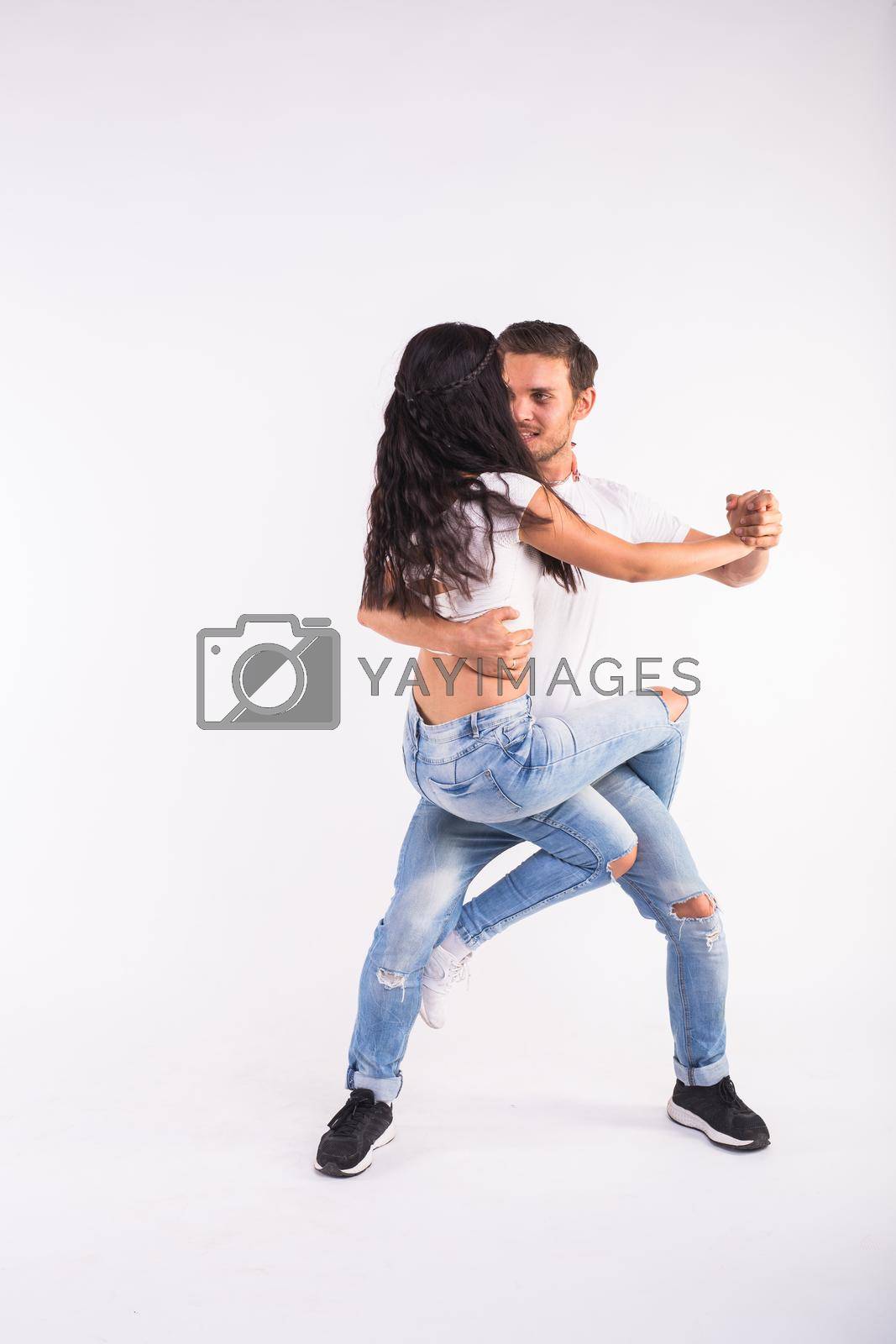 Royalty free image of Salsa, kizomba and bachata dancers on white background. Social dance concept by Satura86