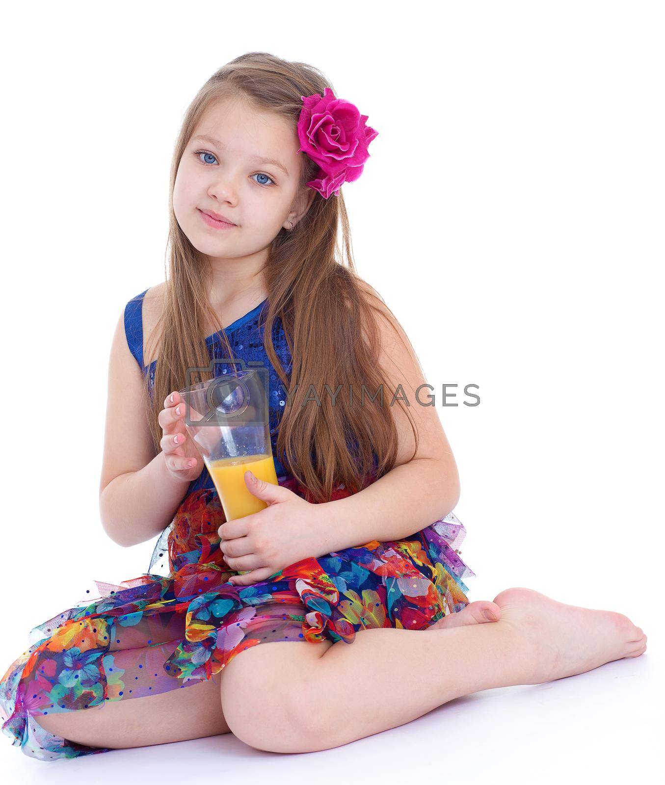 girl, fashion, rose in her hair and orange juice in a glass- Portrait of happy little girl drinking orange juice