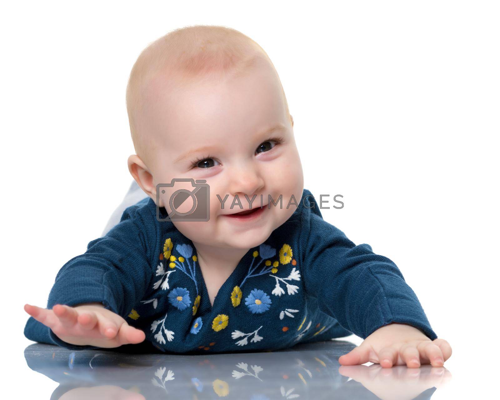 Royalty free image of A cute, very little girl is lying on the floor on a white backgr by kolesnikov_studio