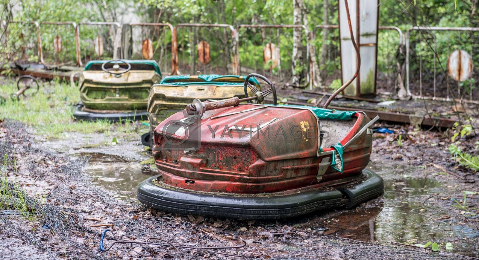 Royalty free image of obsolete rusty cars in Pripyat park by tan4ikk1