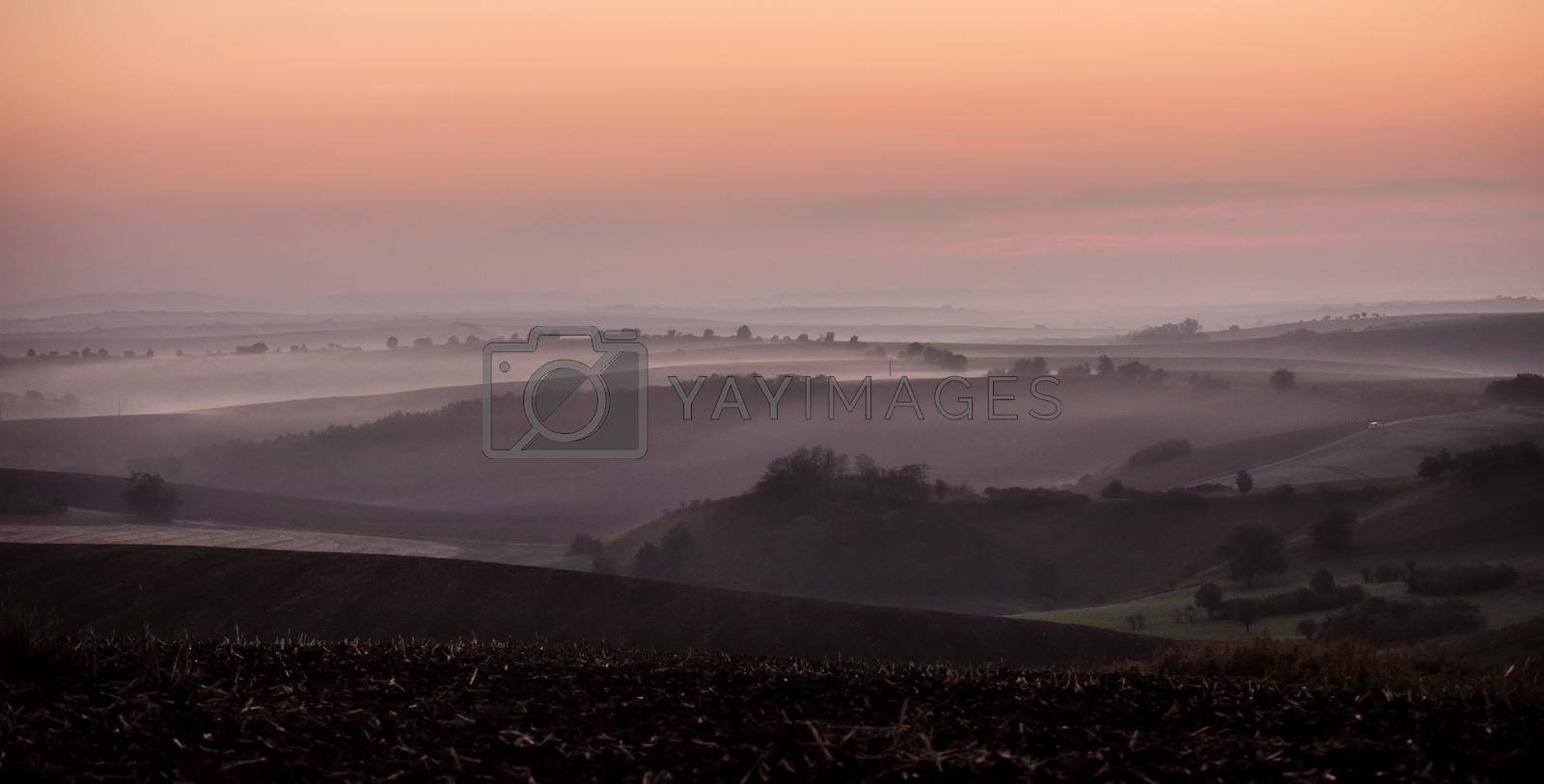 Morning view of spacious Moravian landscape covered with fog