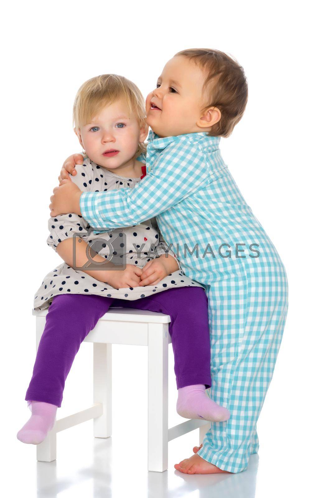 Royalty free image of Babies boys and a girl cute embrace. by kolesnikov_studio