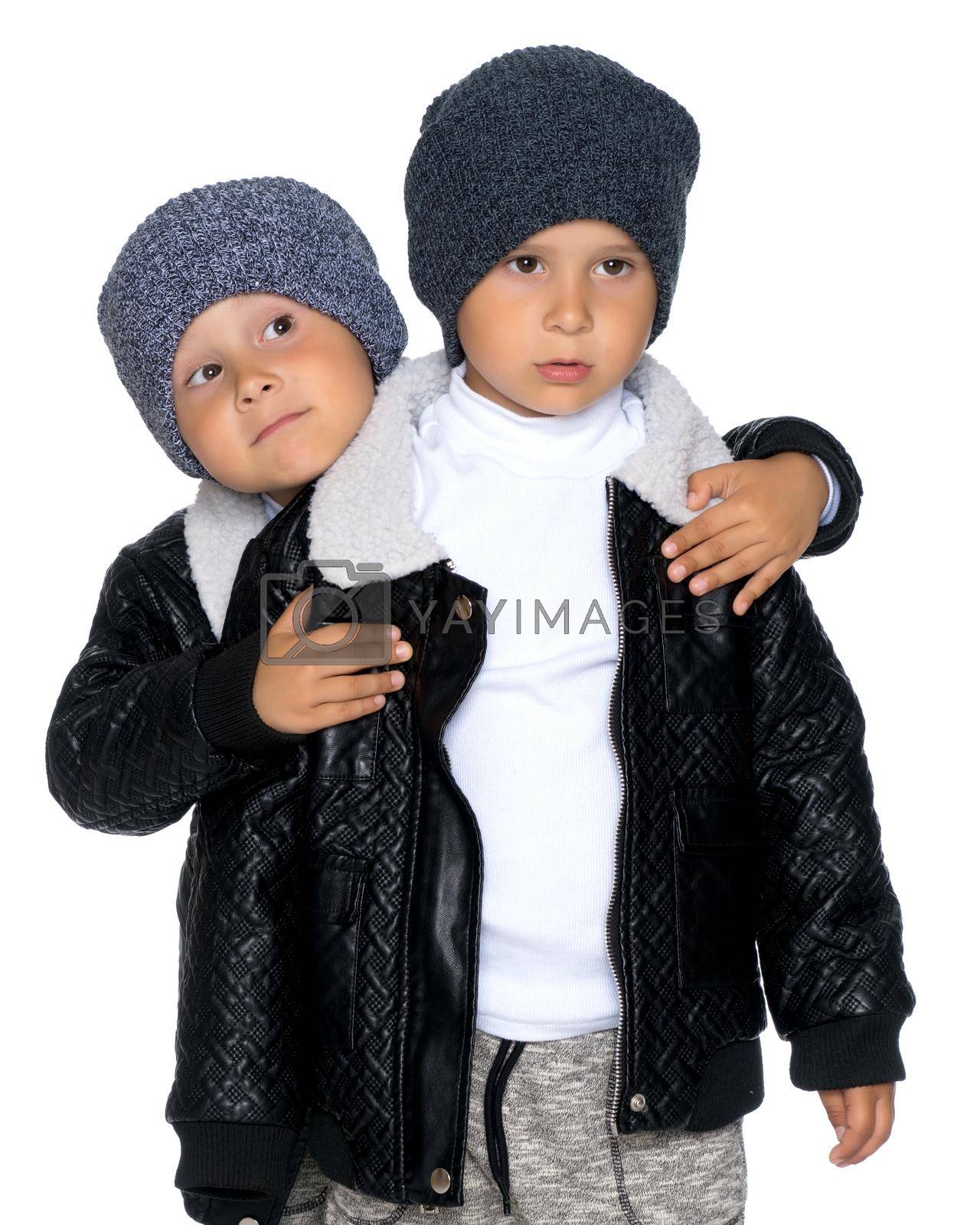 Royalty free image of Two little boys in black jackets and hats. by kolesnikov_studio