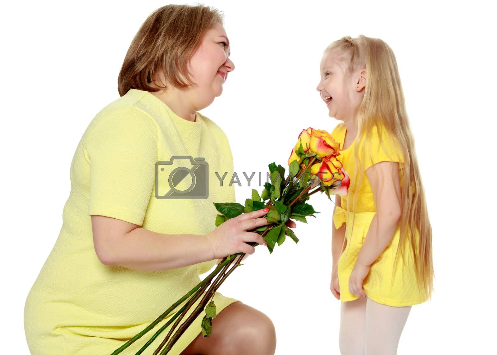 Royalty free image of Mom and little daughter plus the size of the model, with a bouqu by kolesnikov_studio