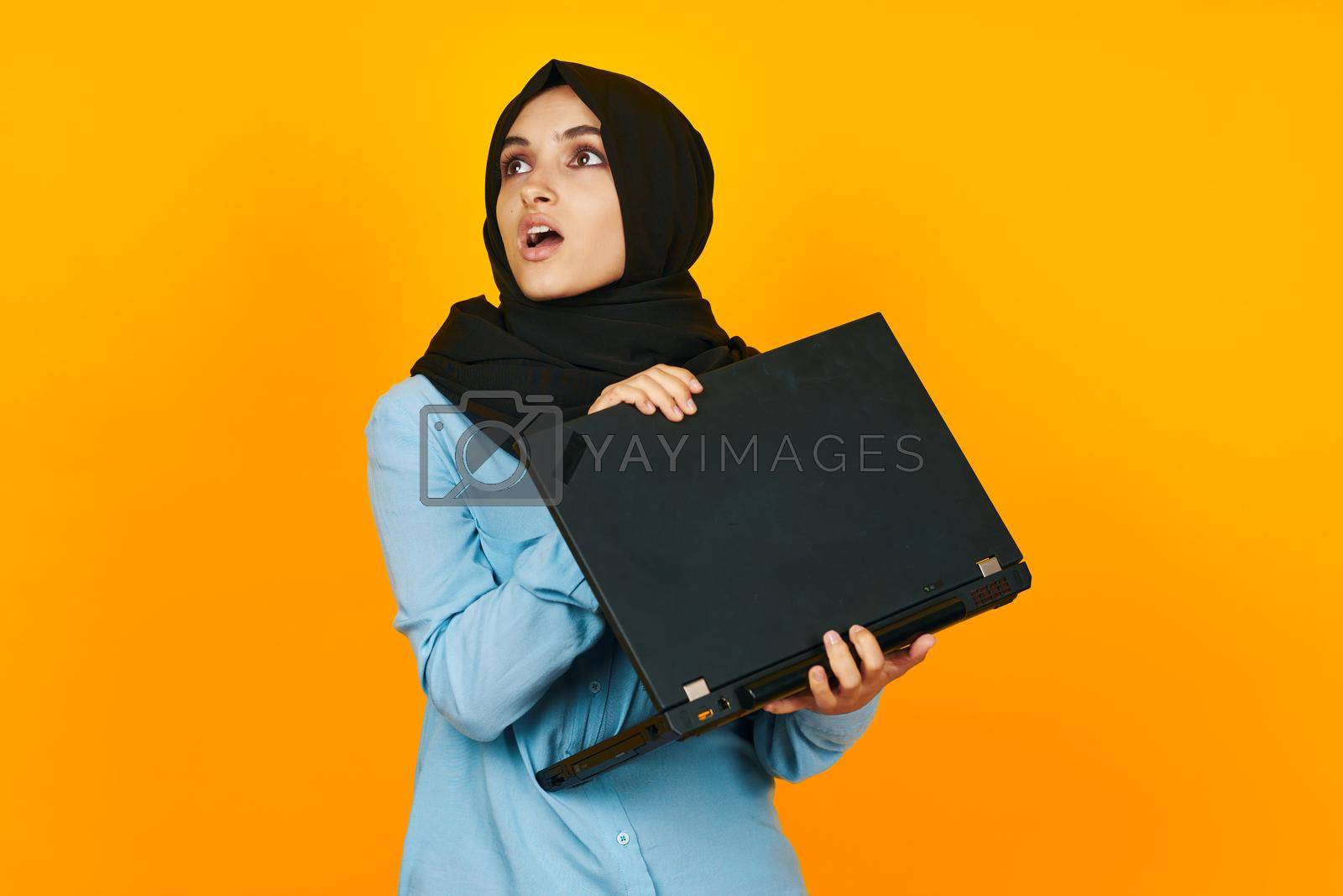 Royalty free image of Muslim laptop posing technology internet ethnicity model by Vichizh