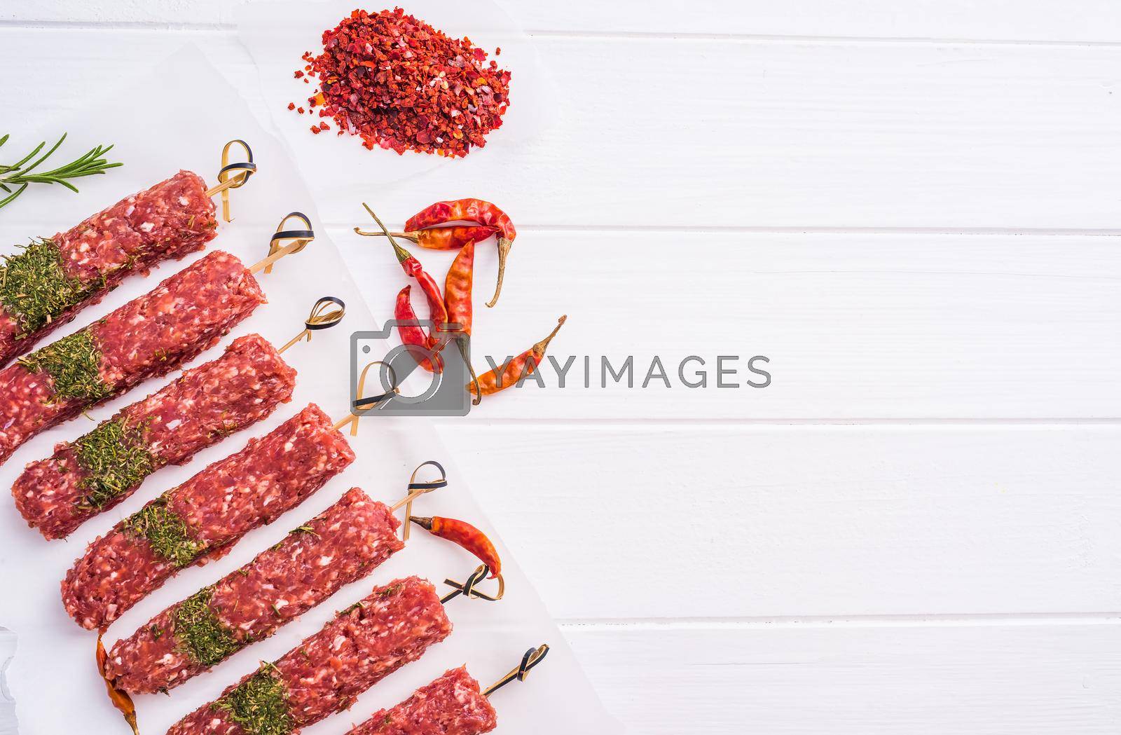 Royalty free image of Raw kebab with spices by GekaSkr