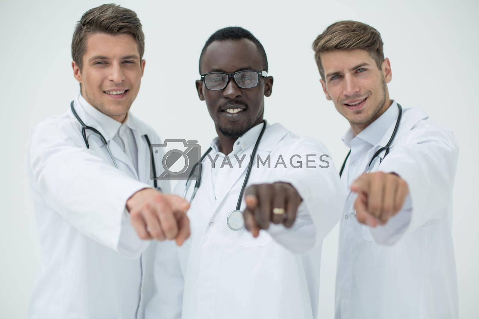 Royalty free image of multinational group of doctors pointing at you by asdf