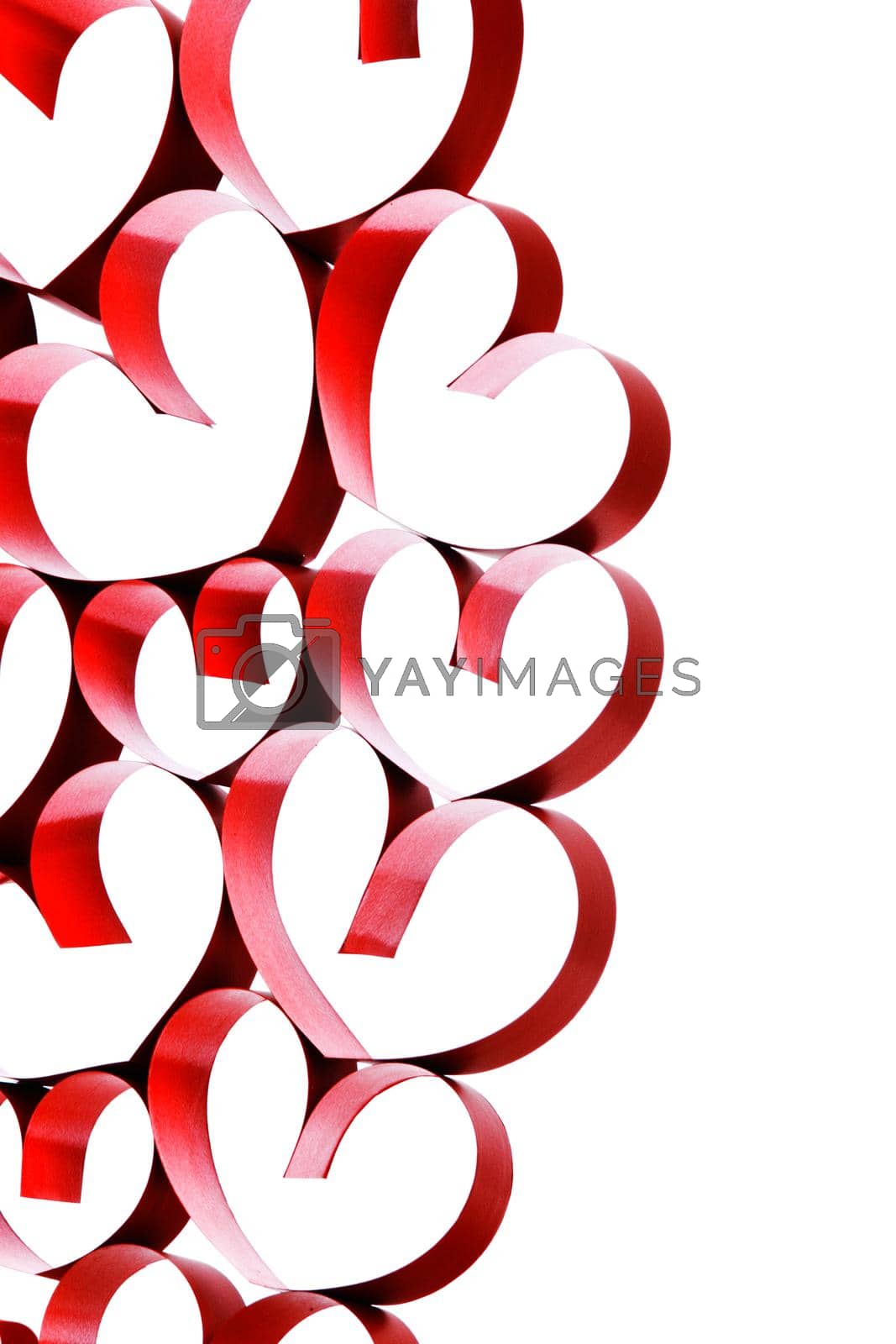 Royalty free image of Linked red ribbon hearts on white by Yellowj