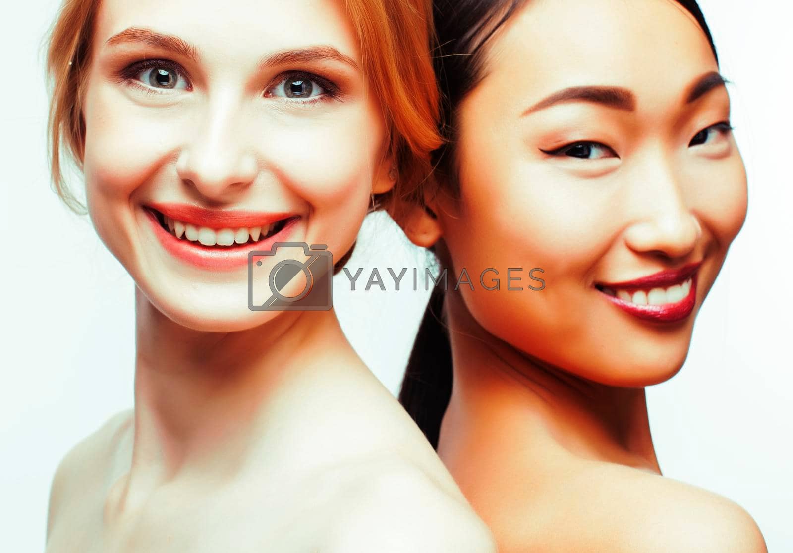 Royalty free image of different nation woman: caucasian and asian together isolated on white background happy smiling, diverse type on skin, lifestyle people concept by JordanJ