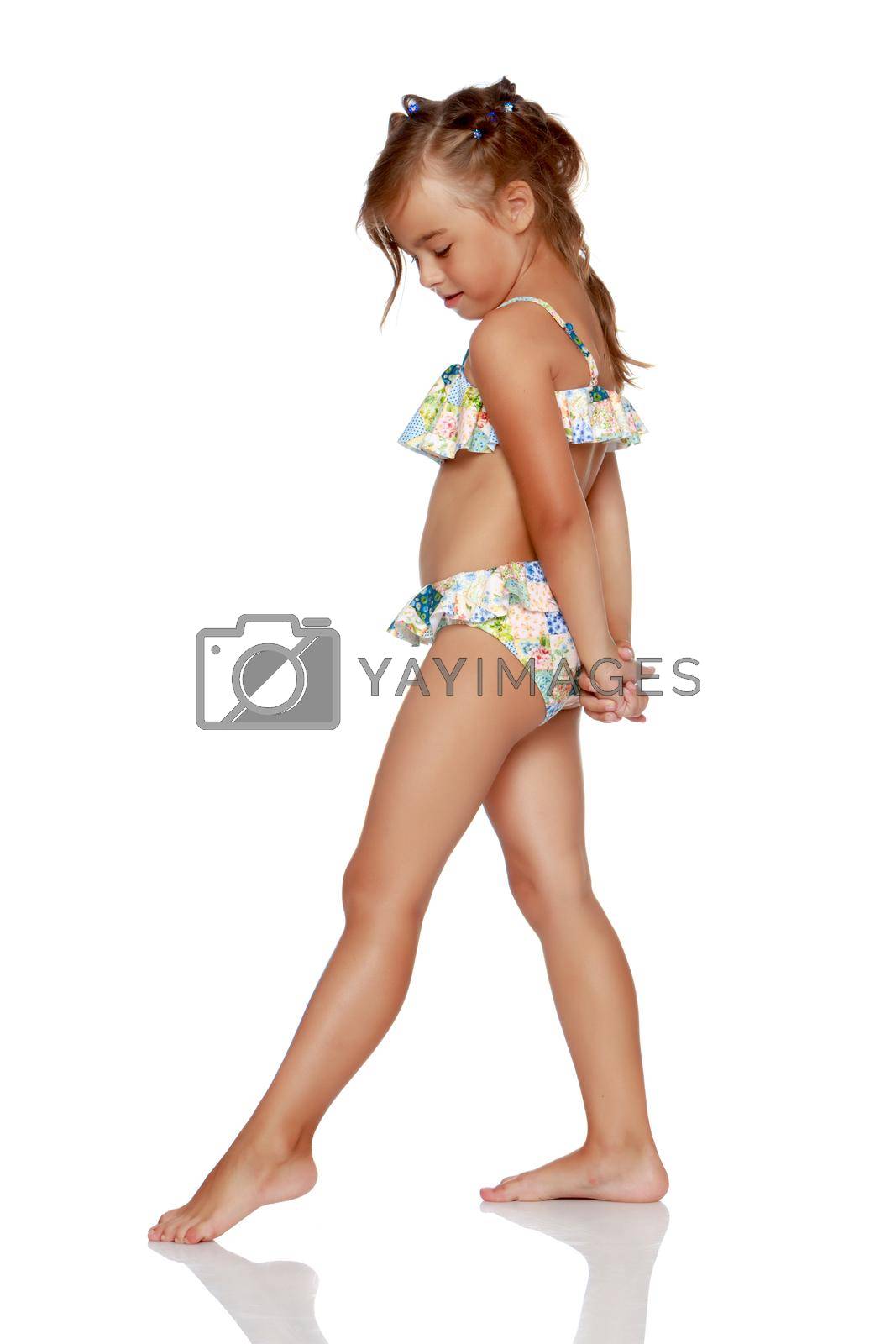 Royalty free image of Tanned little girl in a swimsuit by kolesnikov_studio
