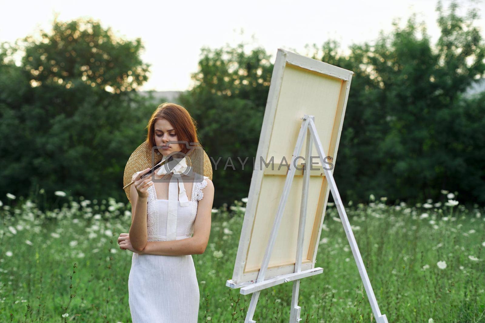 Royalty free image of woman artist outdoors landscape creative hobby lifestyle by Vichizh