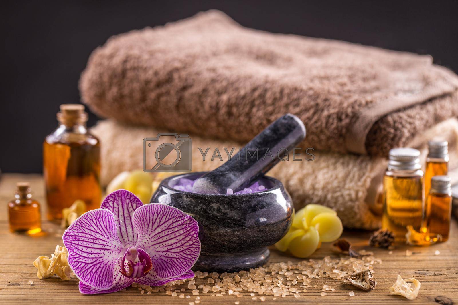 Spa concept of massage oil and towel
