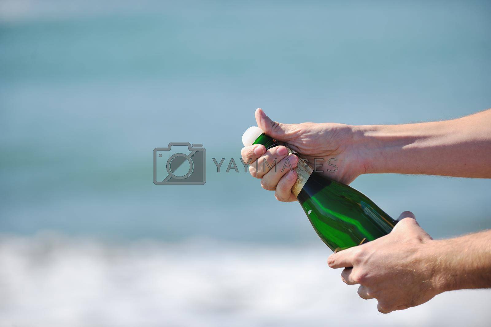 man hands open bottle of champagne alcohol and wine drink outdoor on party celebration event 